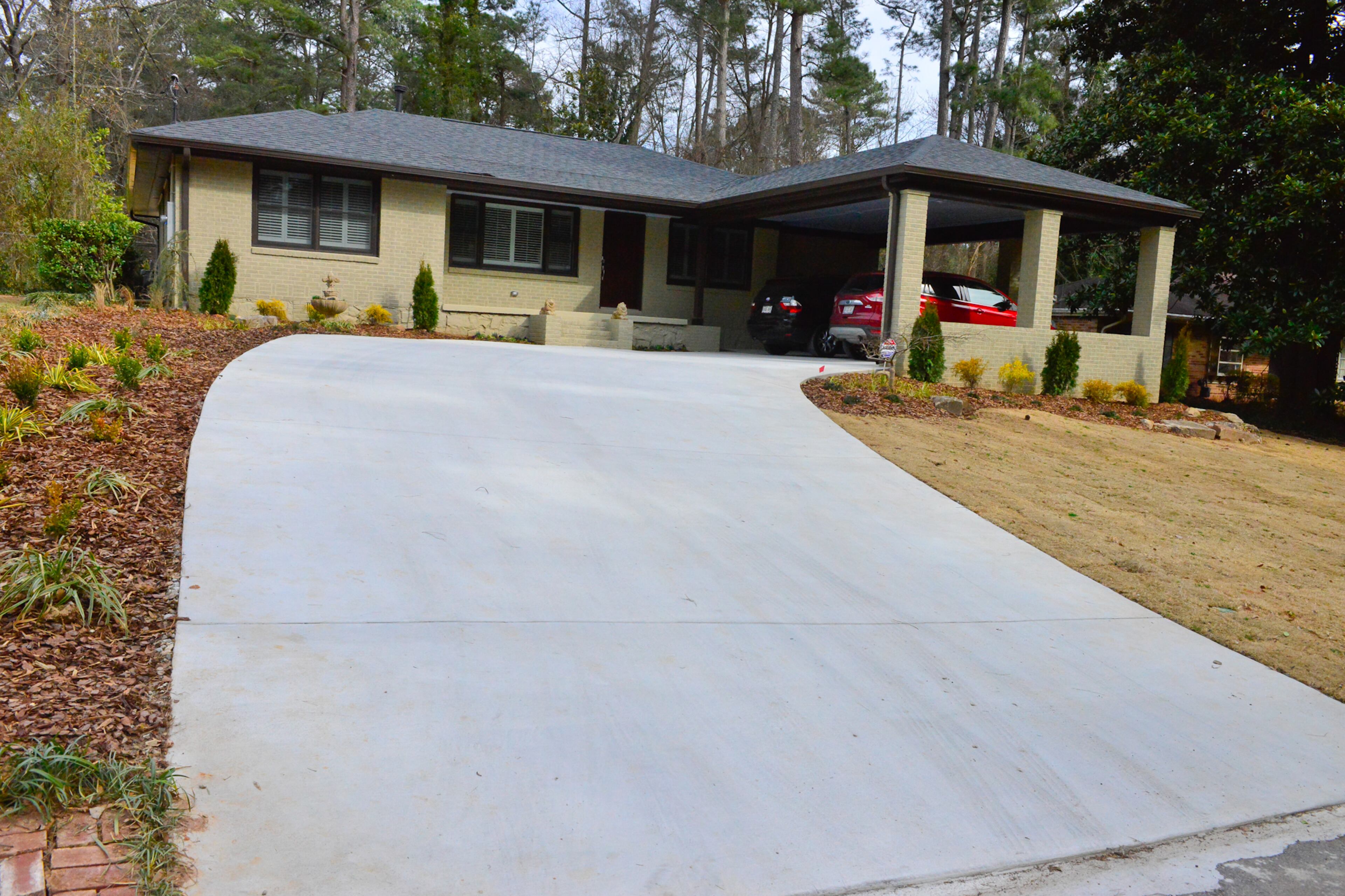 The exterior, driveway and yard also received an overhaul during the renovation by Gary Collins of Southland Contracting Services to the Decatur home owned by Michael Bush and Johnny Mitchell. The driveway was changed from straight to curved, more than a dozen trees were removed, and a carport was added to the front of the three-bedroom ranch.