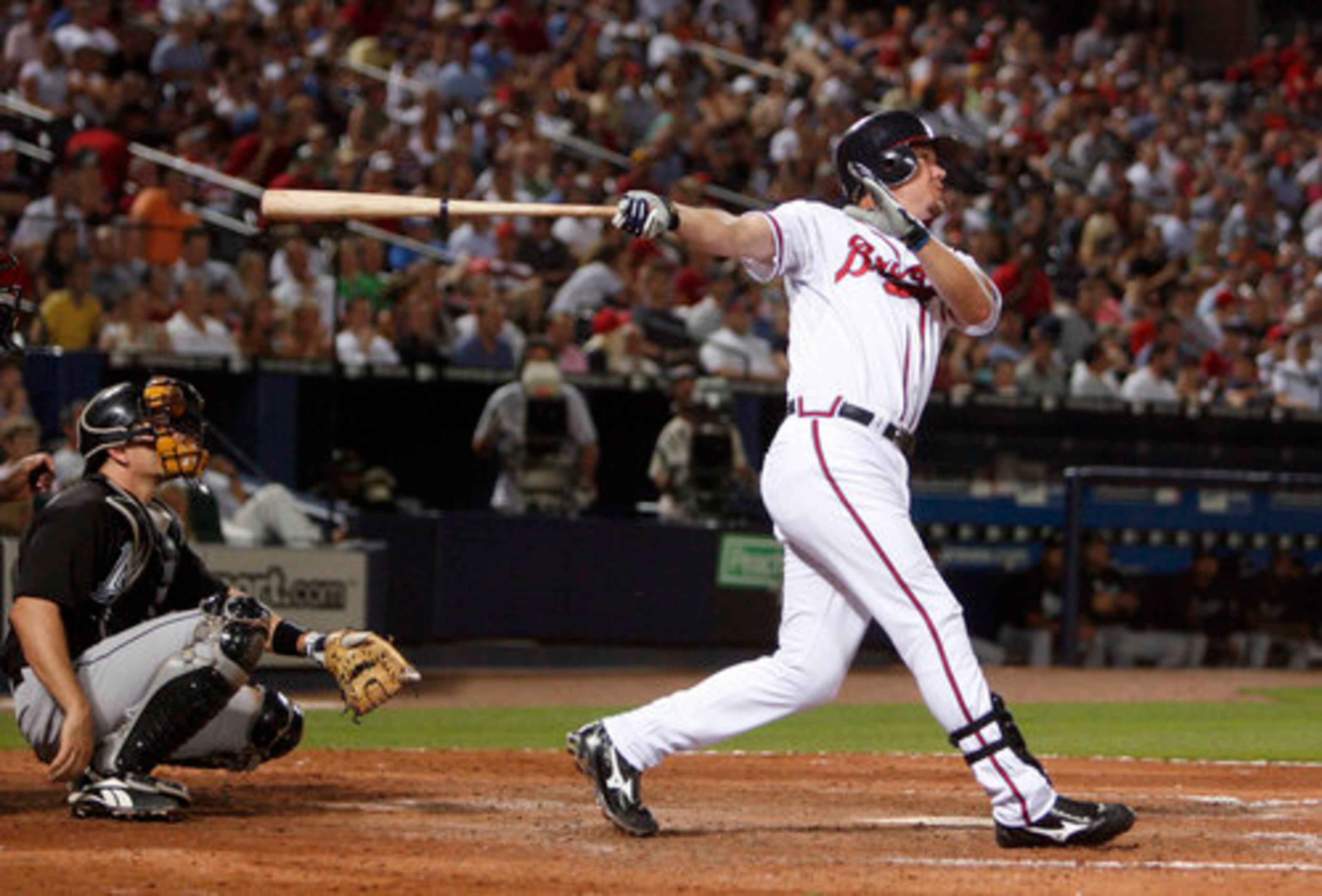 Atlanta Braves' third baseman Chipper Jones hits the 400th home run of his career in the 6th inning June 5 against the Florida Marlins at Turner Field. Jones received a standing ovation of 27,238 fans including a video highlight film after the home run of his career. Jones went 4-for-5 at the plate for the night.