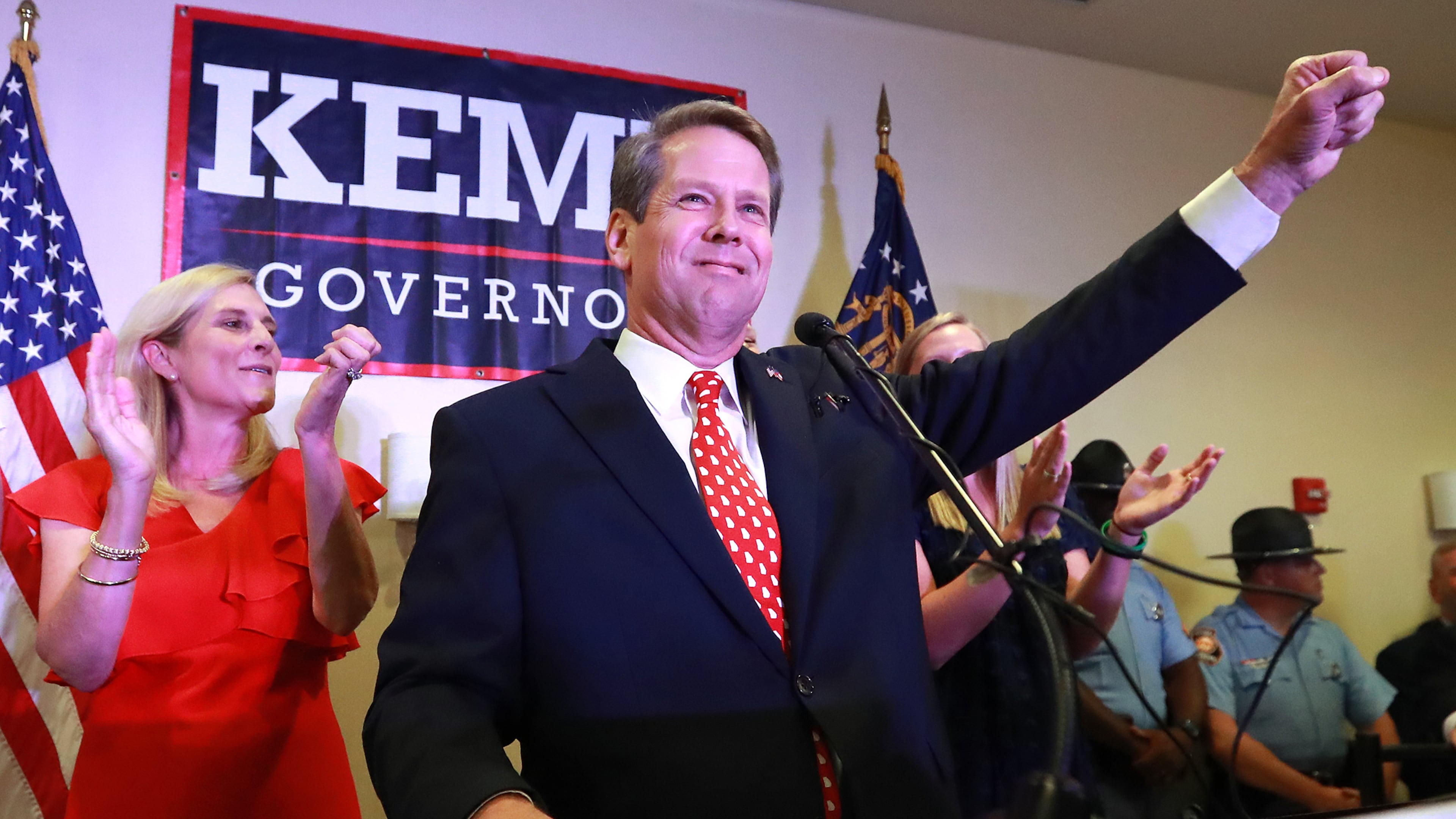 Then-Secretary of State Brian Kemp, backed by his wife Marty, gives his victory speech in the GOP runoff election at the Holiday Inn on Tuesday, July 24, 2018, in Athens. (Curtis Compton/AJC)