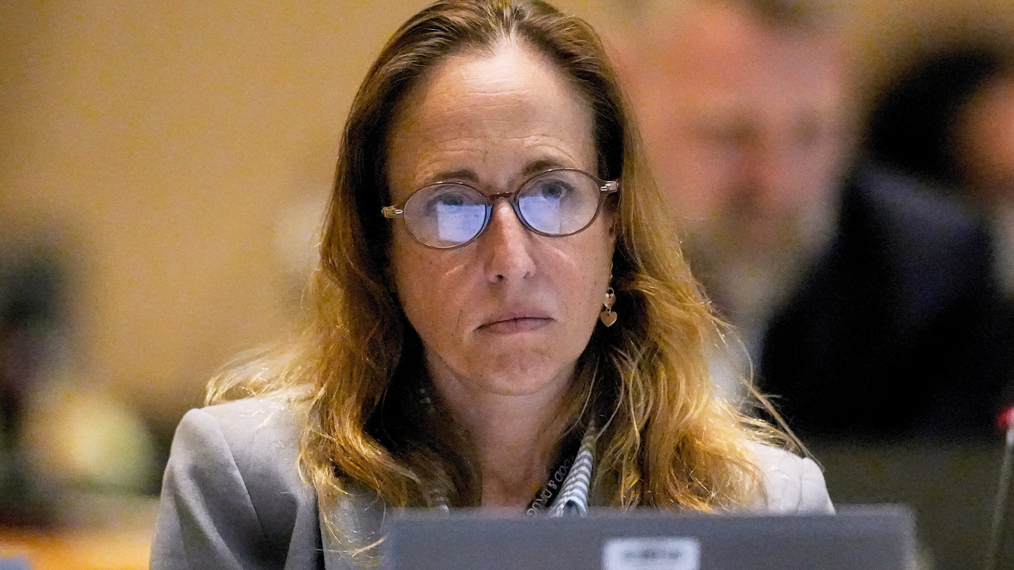 FILE - Dr. Tracy Beth Hoeg, with the FDA, listens during a meeting of the Advisory Committee in Immunization Practices at the CDC, June 25, 2025, in Atlanta. (AP Photo/Mike Stewart, File)