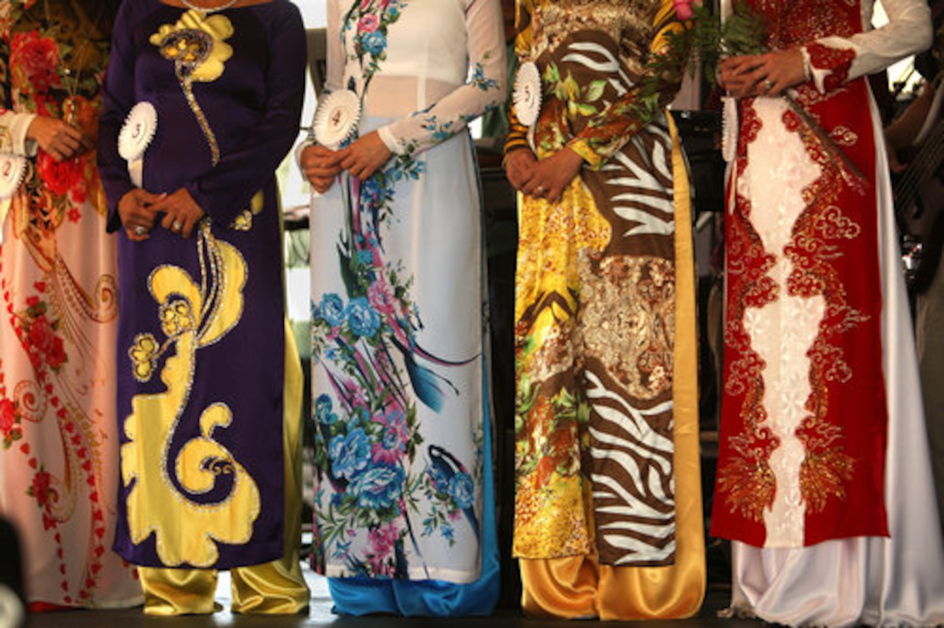 Contestants take turn to showcase thier silk tunic ao dai, a Vietnamese national costume, during the first round of the traditional dress contest during The Holy Martyrs of Vietnam Catholic Church's 2nd Annual Fall Festival in Norcross Sunday, September 5, 2010.