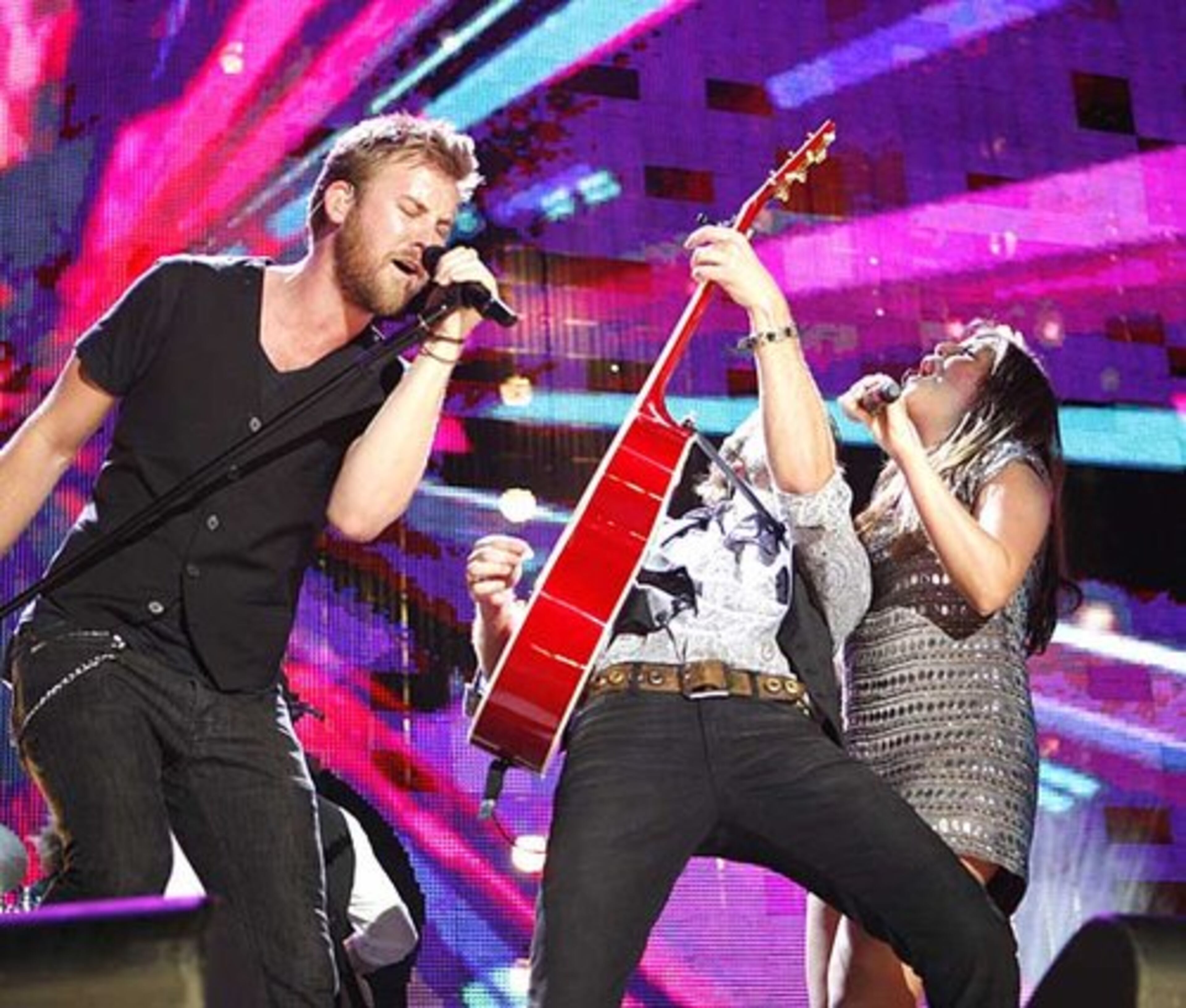 Lady Antebellum performs at the CMA Music Festival. The group features Augusta pals Charles Kelley, left, and Dave Heywood, who teamed up with Hillary Scott.
