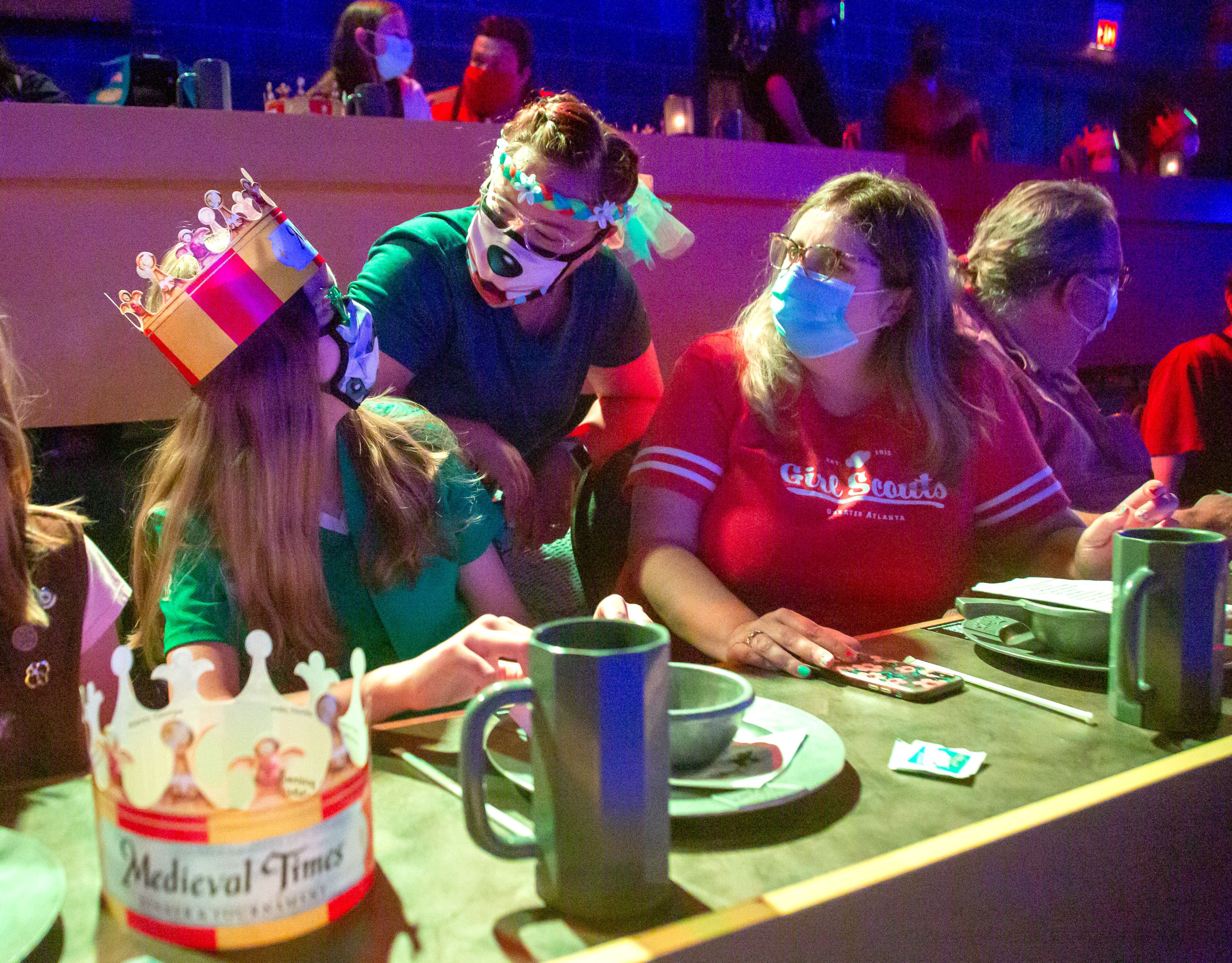 Girl Scouts Troop Leader Bridgette McNeal (right) and her daughter Julia, 11, (left), talk with people while waiting for the Medieval Times show to start at Sugarloaf Mills Mall in Lawrenceville Saturday. McNeal escorted her daughter and other girls there for a troop outing. Julia is looking forward to summer camp. May 22, 2021. STEVE SCHAEFER FOR THE ATLANTA JOURNAL-CONSTITUTION