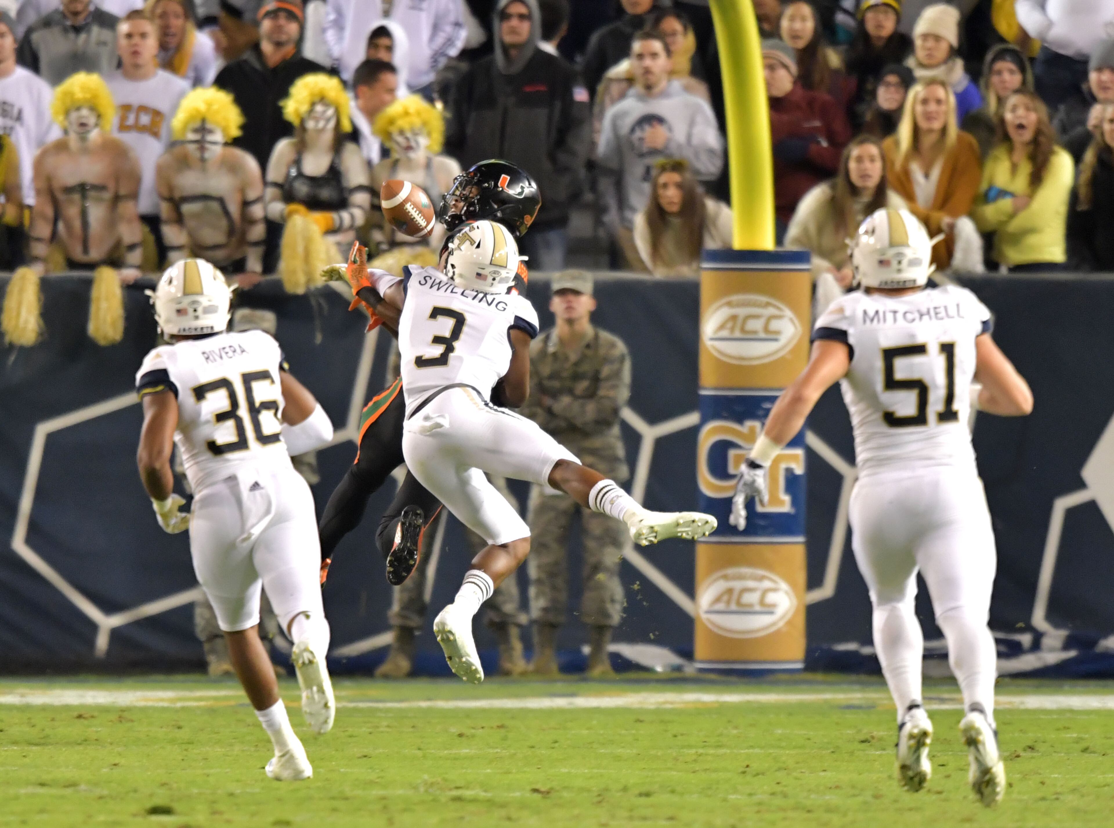 November 10, 2018 Atlanta - Georgia Tech defensive back Tre Swilling (3) breaks up a pass to Miami wide receiver Lawrence Cager (18) in the first half at Bobby Dodd Stadium on Saturday, November 10, 2018. HYOSUB SHIN / HSHIN@AJC.COM