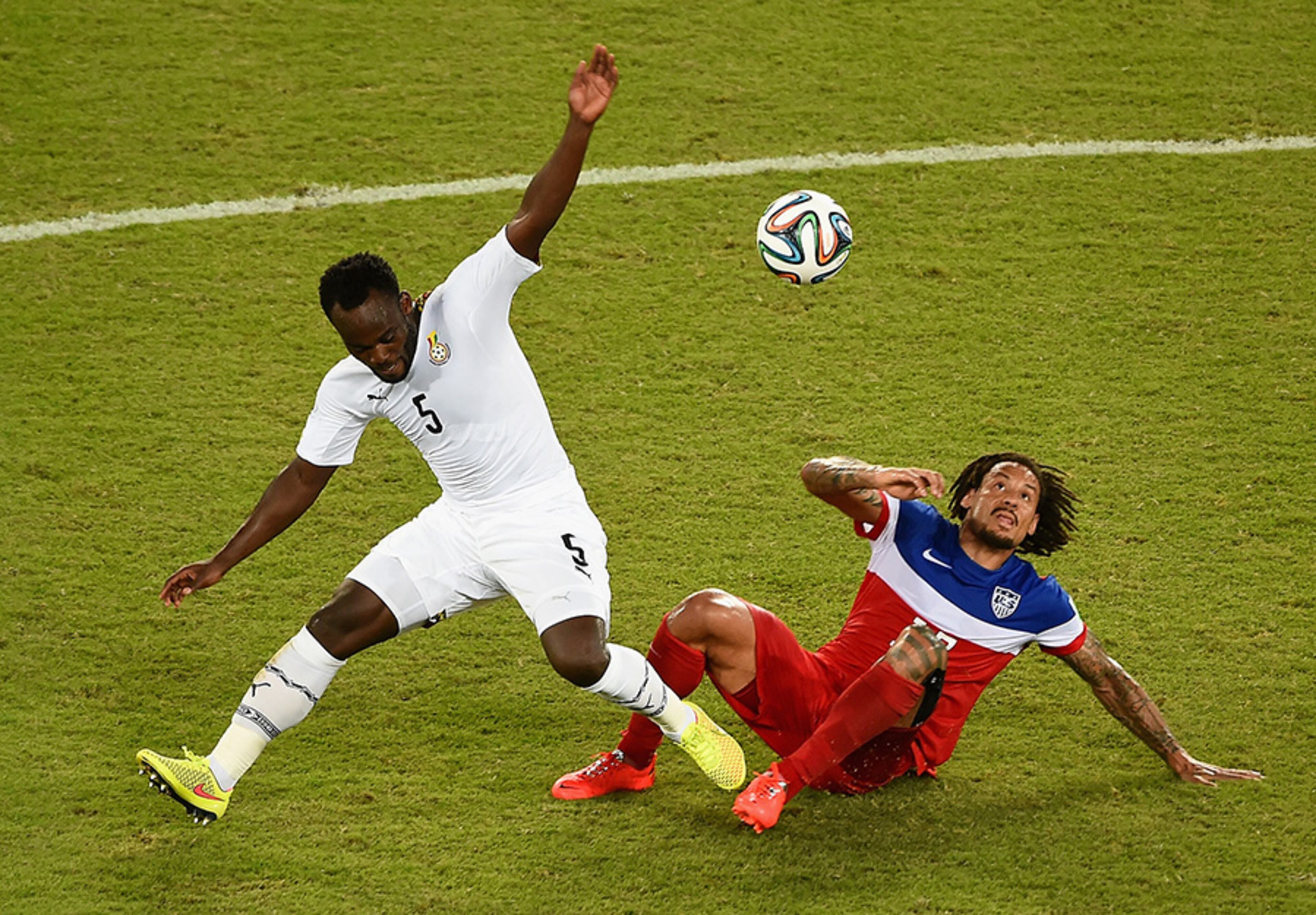 Michael Essien of Ghana is challenged by Jermaine Jones of the United States during the 2014 FIFA World Cup Brazil Group G match between Ghana and the United States at Estadio das Dunas on June 16, 2014 in Natal, Brazil.