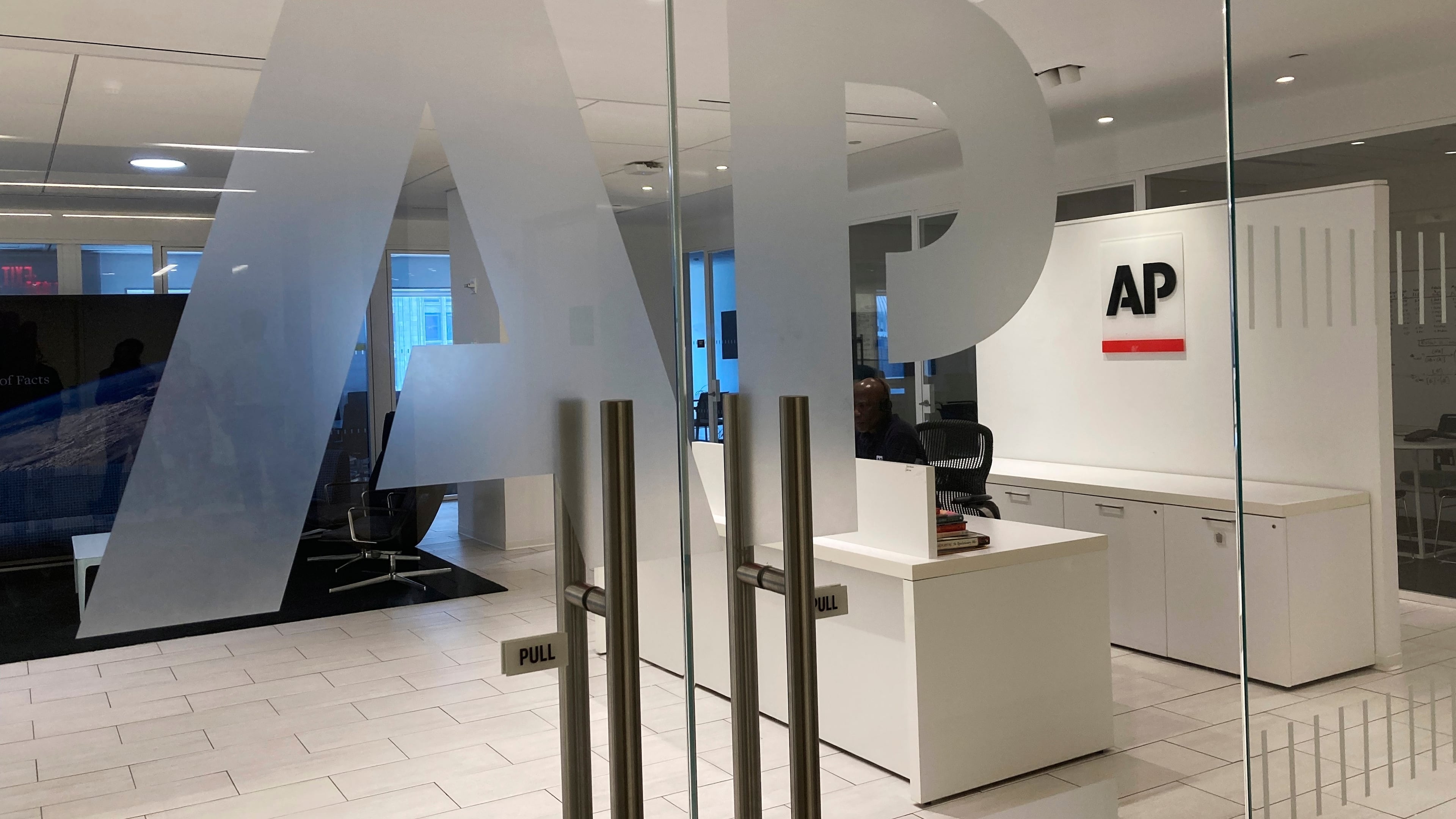 FILE - The Associated Press logo is shown at the entrance to the news organization's office in New York, July 13, 2023. (AP Photo/Aaron Jackson, File)