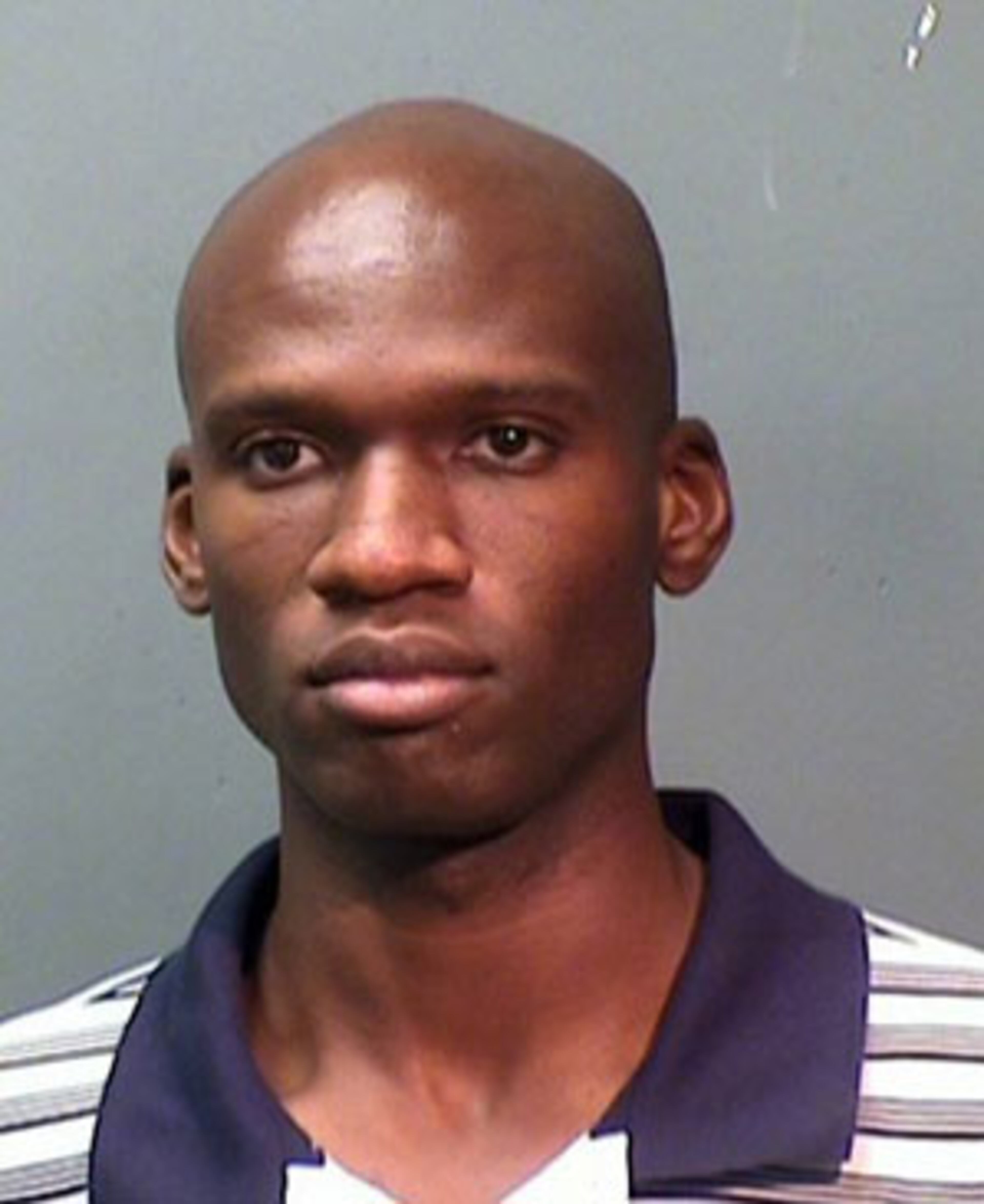 Booking mug of Aaron Alexis, arrested in September 2010 on suspicion of discharging a firearm in the city limits. Alexis is suspected to be the shooter at the Washington, D.C., Navy Yard on Sept. 16, 2013.