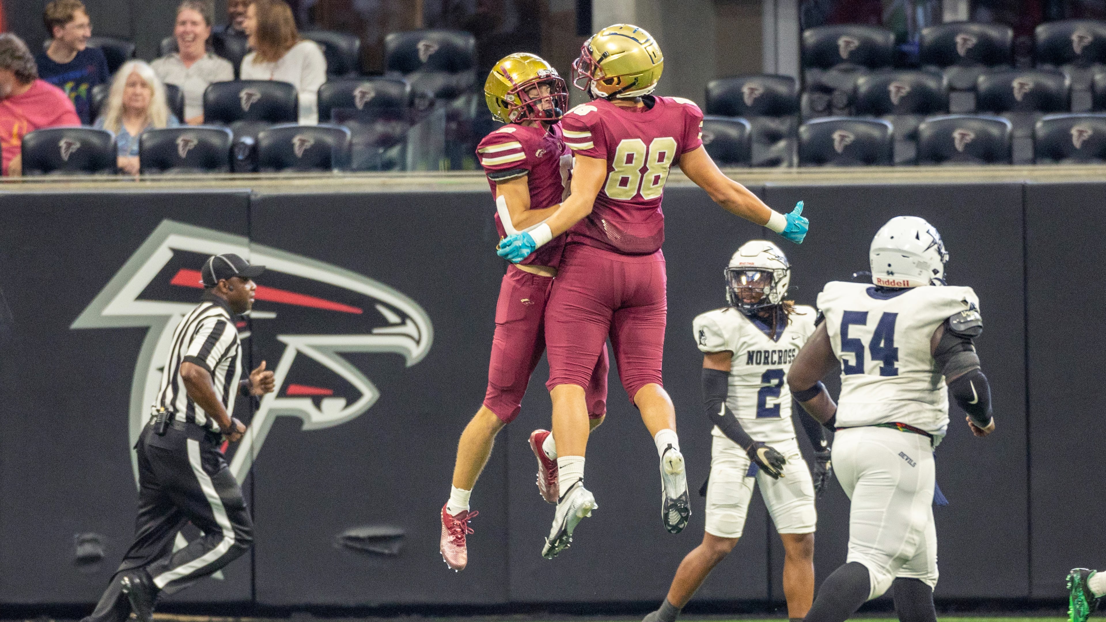 Brookwood High School player Evan Gober (R) celebrates with Bryce Dopson after Dopson ran a kickoff back for a touchdown during their game with Norcross during the Corky Kell Classic at the Mercedes Bens Stadium Saturday, August 20, 2022. Steve Schaefer/steve.schaefer@ajc.com)