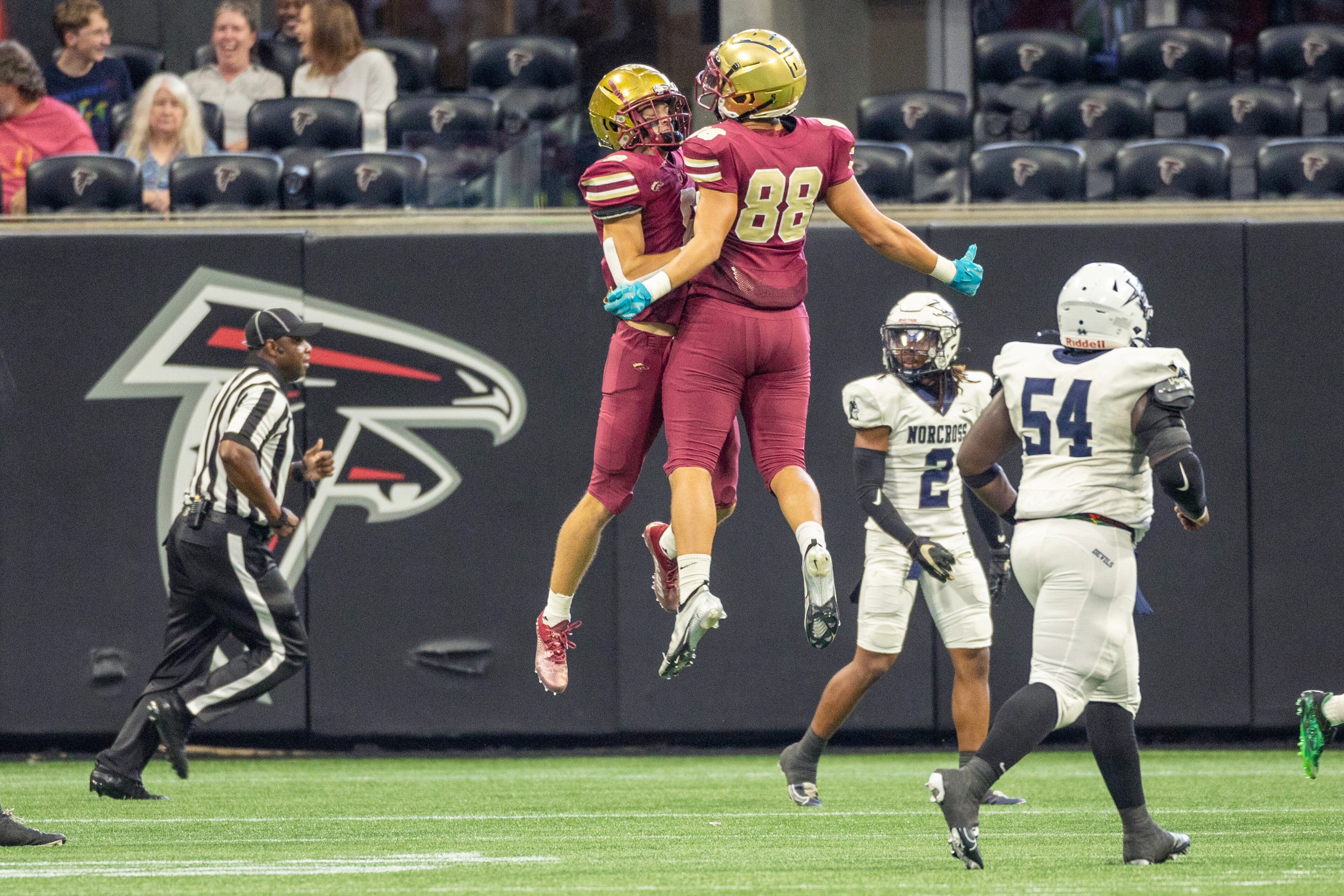 Brookwood High School player Evan Gober (R) celebrates with Bryce Dopson after Dopson ran a kickoff back for a touchdown during their game with Norcross during the Corky Kell Classic at the Mercedes Bens Stadium Saturday, August 20, 2022. Brookwood won 28-24. Steve Schaefer/steve.schaefer@ajc.com)