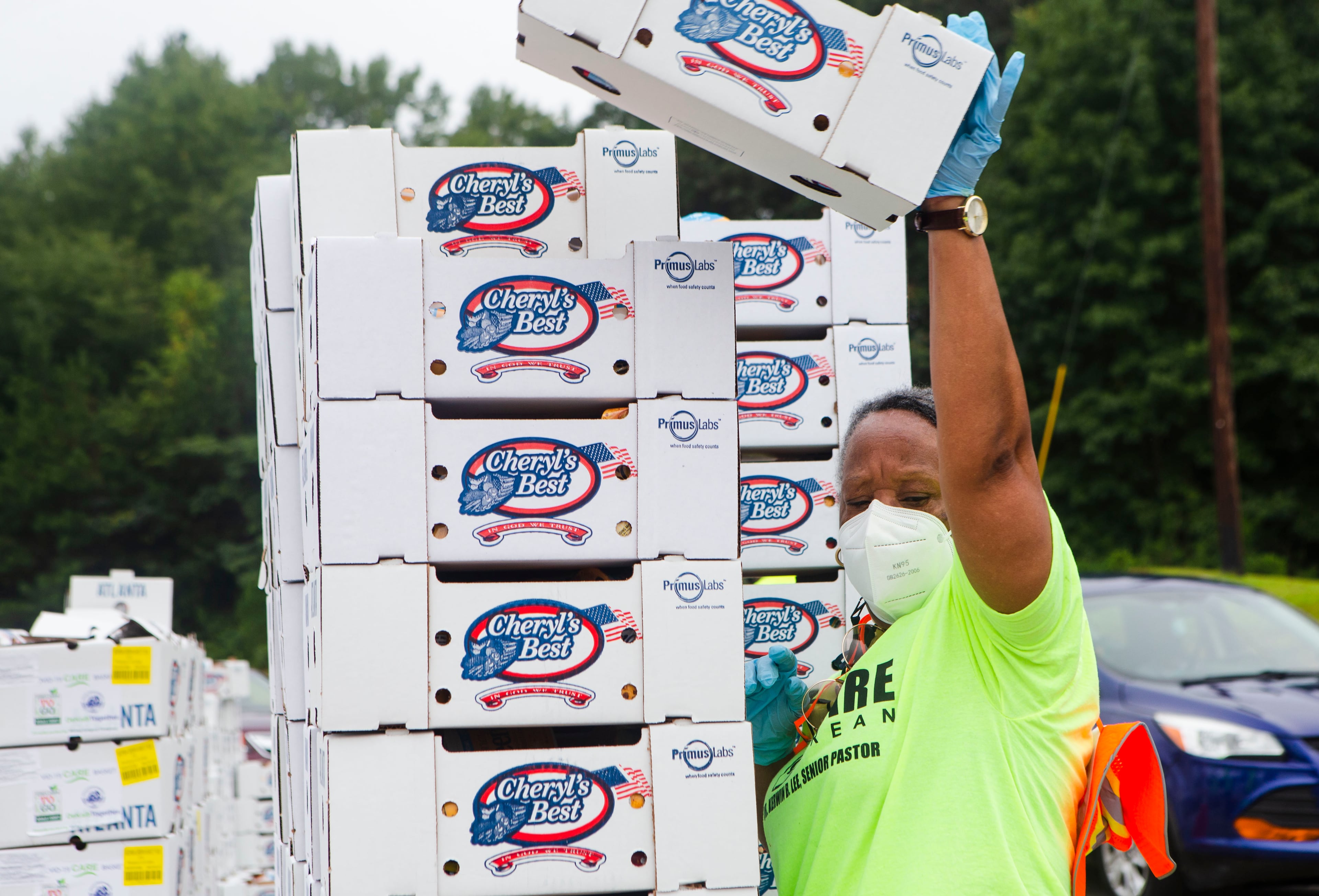 Ora Goodwin volunteers during a food giveaway event at Berean Christian Church on Saturday, August 27, 2022, in Stone Mountain. In an attempt to address COVID-related food insecurity, DeKalb County has held monthly food distributions since May 2020. CHRISTINA MATACOTTA FOR THE ATLANTA JOURNAL-CONSTITUTION.