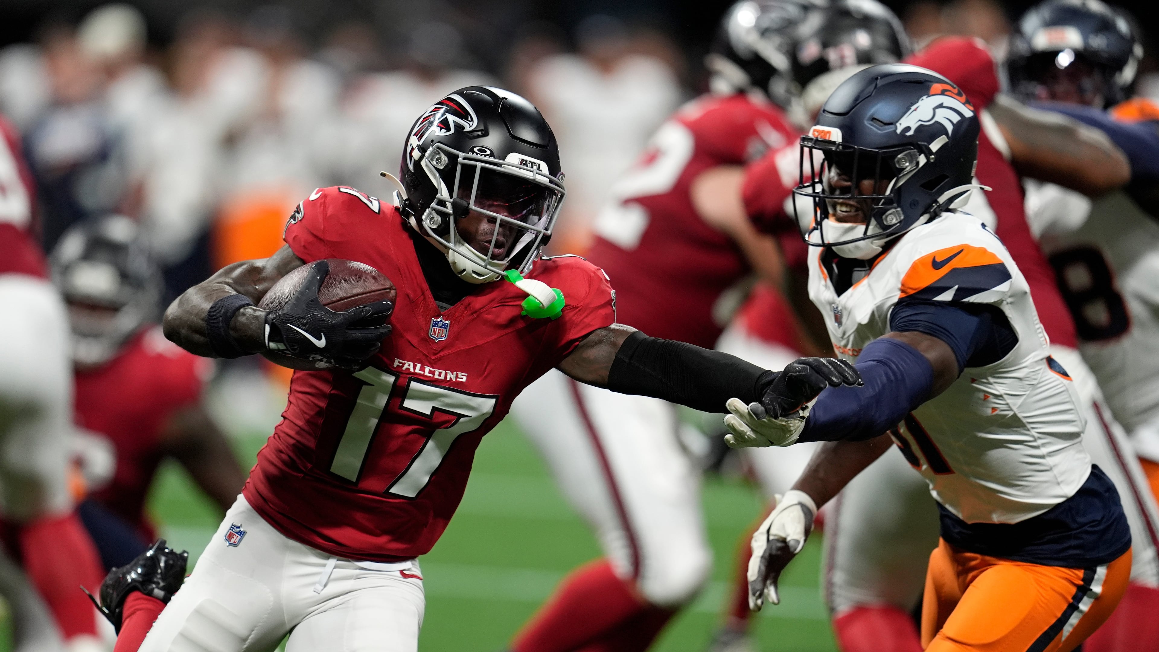Atlanta Falcons wide receiver Zachariah Branch (left) runs against Denver Broncos linebacker Que Robinson during the first half of a preseason NFL football game, Friday, Aug. 14, 2026, in Atlanta. (Mike Stewart/AP)