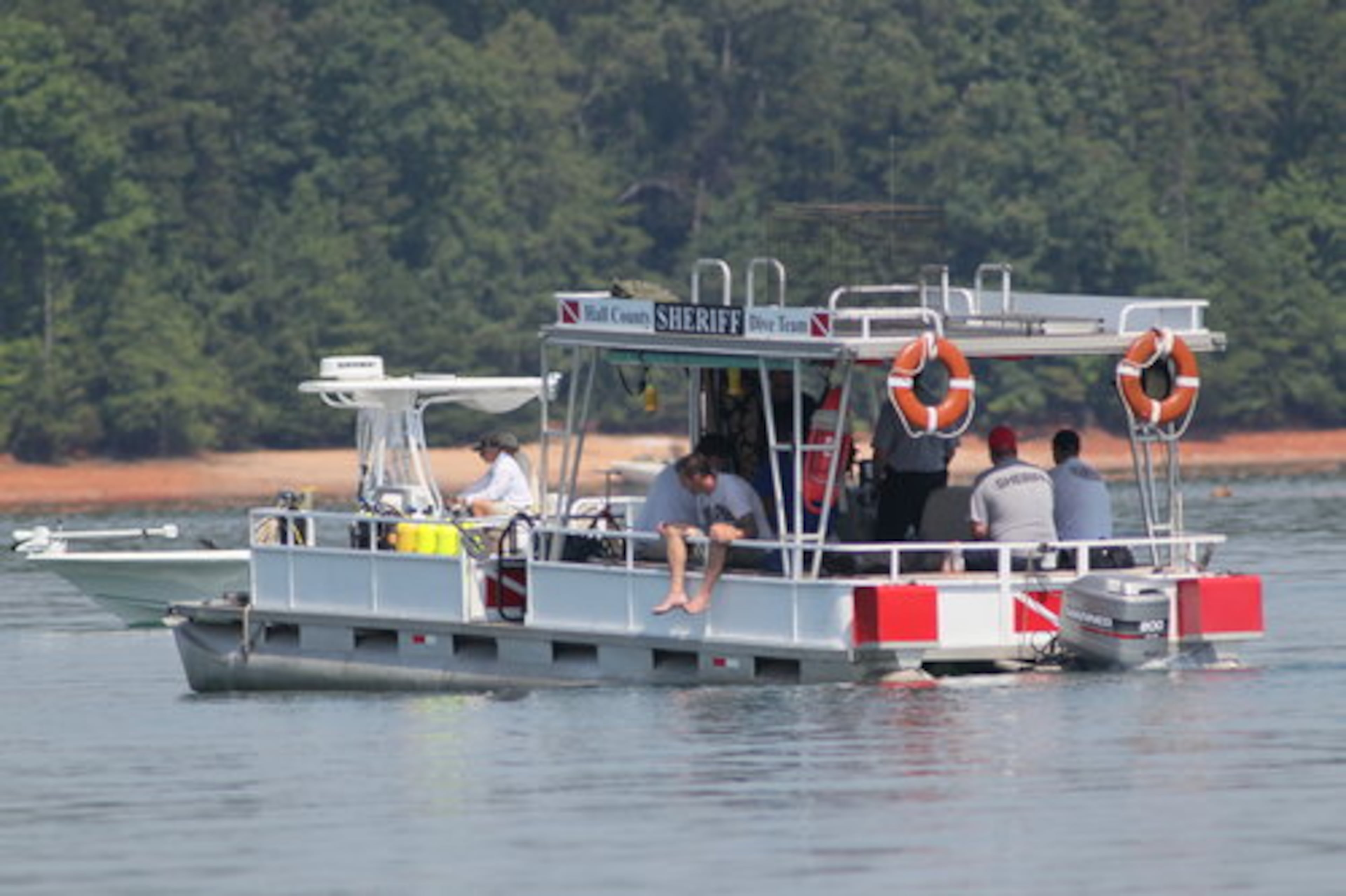 Crews were out on Lake Lanier looking for a 13-year-old boy, who was still missing after the crash. Paul J. Bennett, 44, of Cumming, has been charged with boating under the influence but could face other charges. He was taken to the Hall County jail.