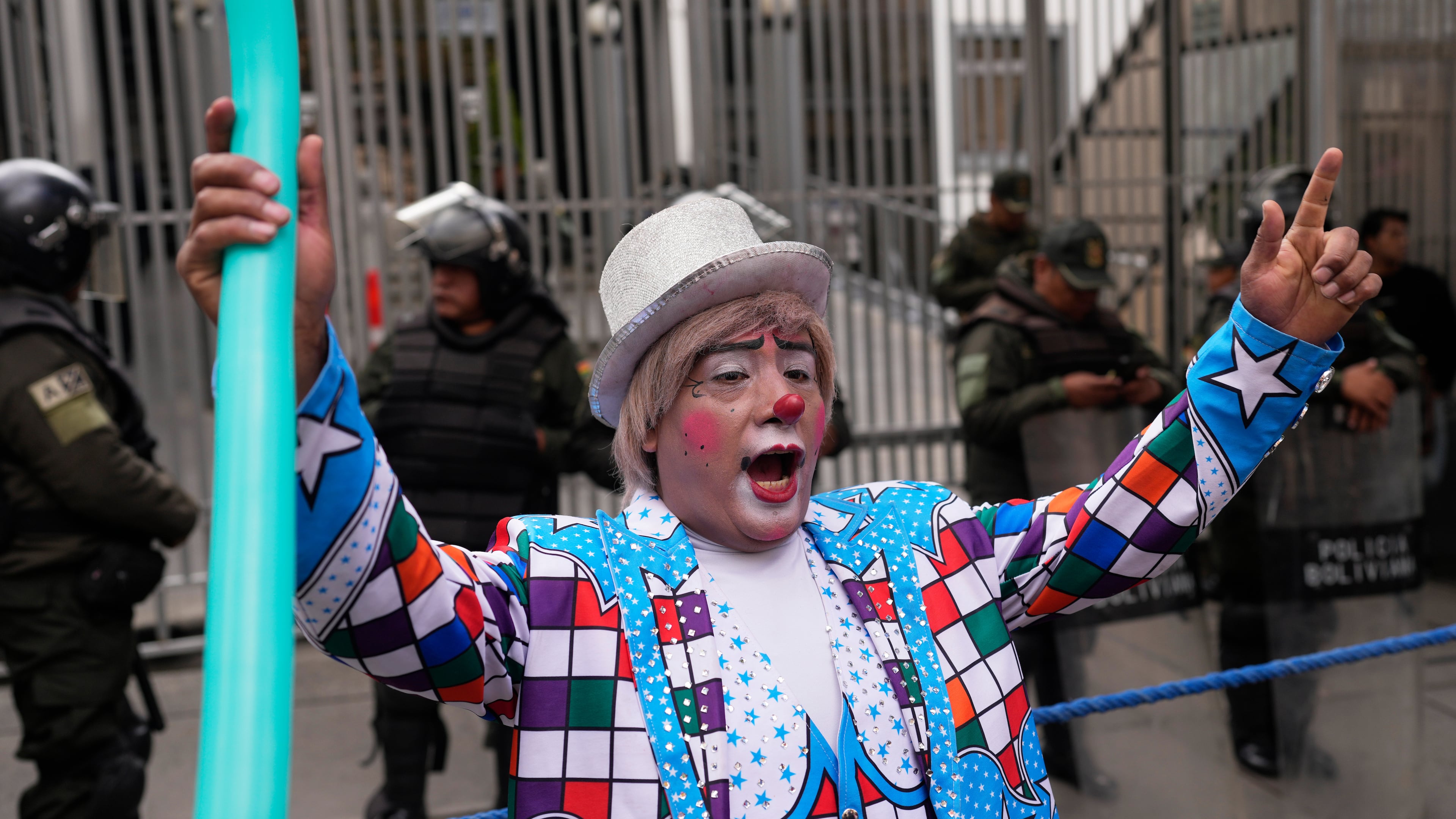 A clown shouts slogans during a protest against the government's ban on holiday parties at schools during teaching hours, outside the Ministry of Education in La Paz, Bolivia, Monday, March 30, 2026. (AP Photo/Juan Karita)