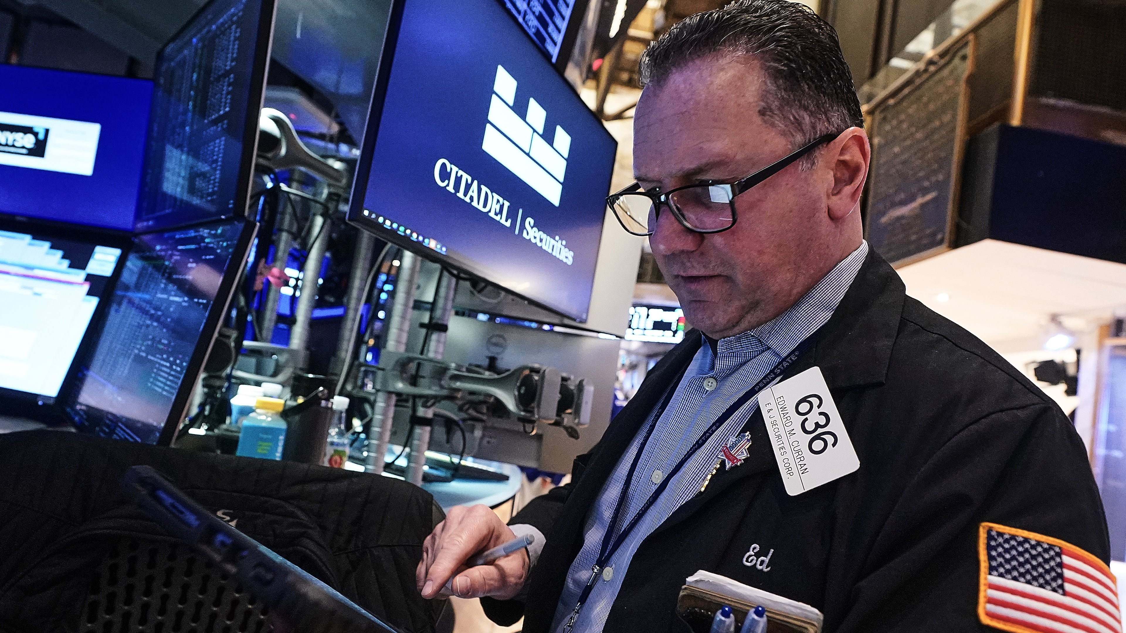 Trader Edward Curran works on the floor of the New York Stock Exchange, Thursday, Jan. 22, 2026. (AP Photo/Richard Drew)