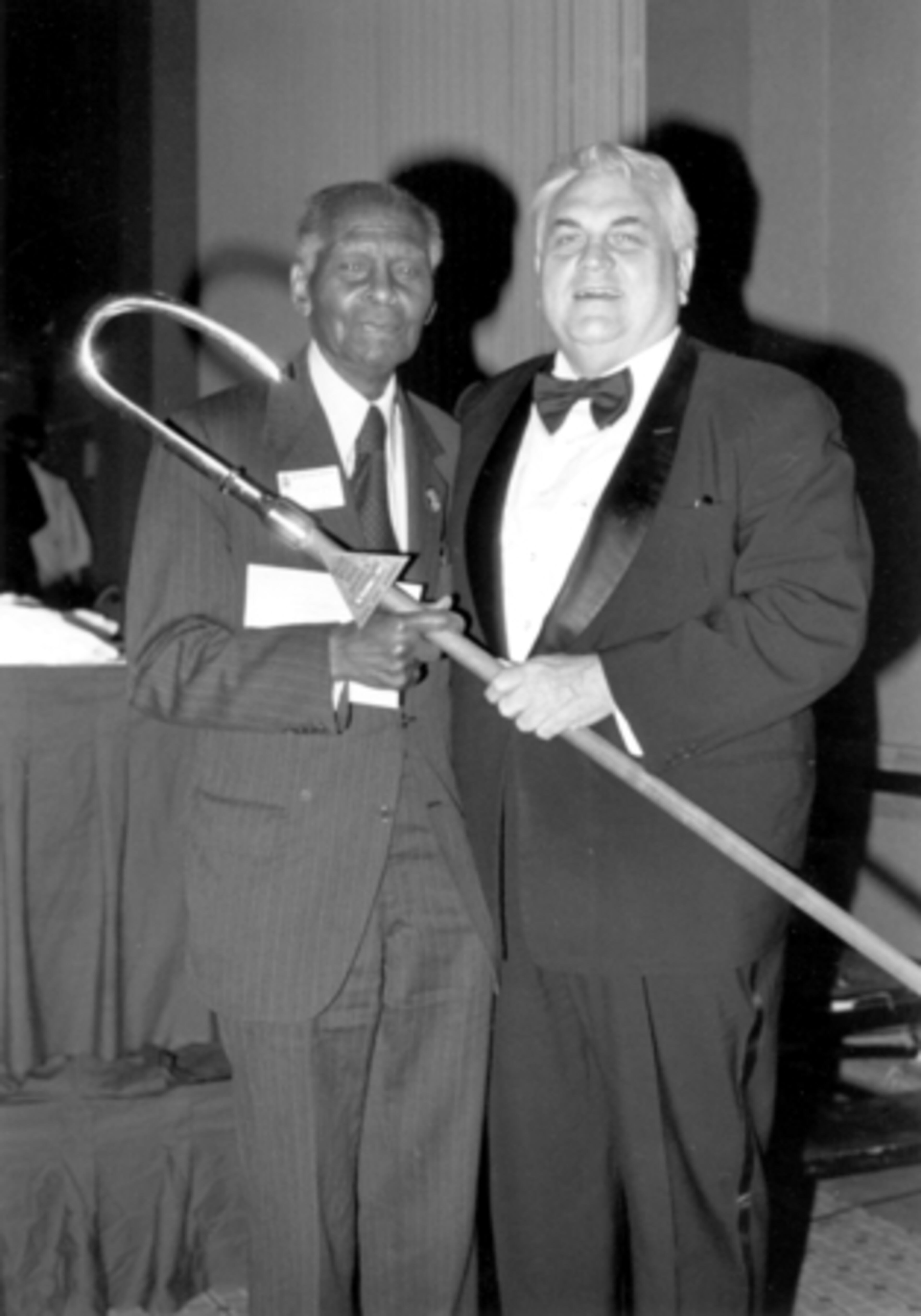Langdale presents Dr. Benjamin Mays with the 1979 Golden Staff award for outstanding community service.