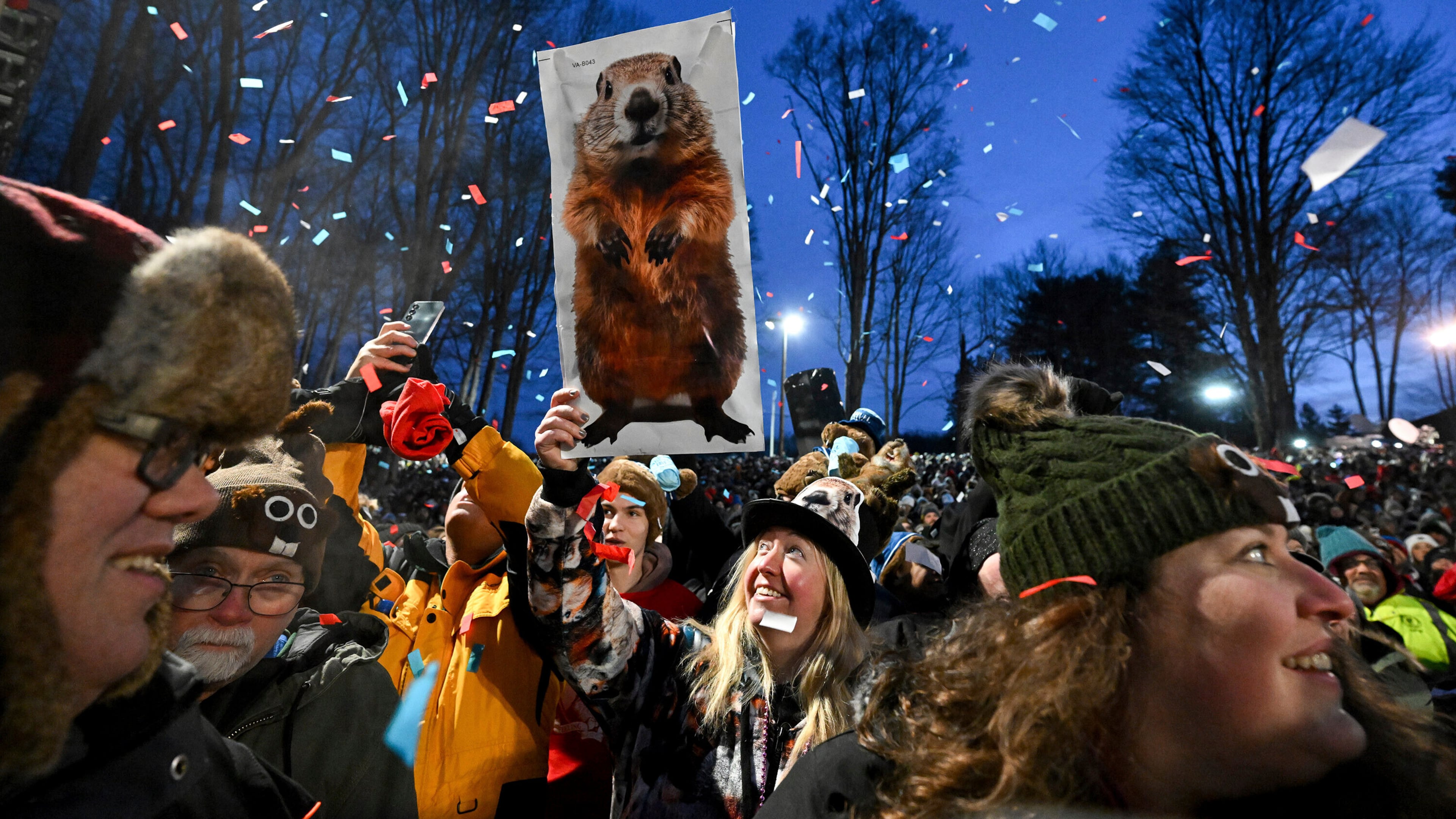 FILE - The crowd watches the festivities while waiting for Punxsutawney Phil, the weather prognosticating groundhog, to come out and make his prediction during the 139th celebration of Groundhog Day on Gobbler's Knob in Punxsutawney, Pa., Feb. 2, 2025. (AP Photo/Barry Reeger, File)