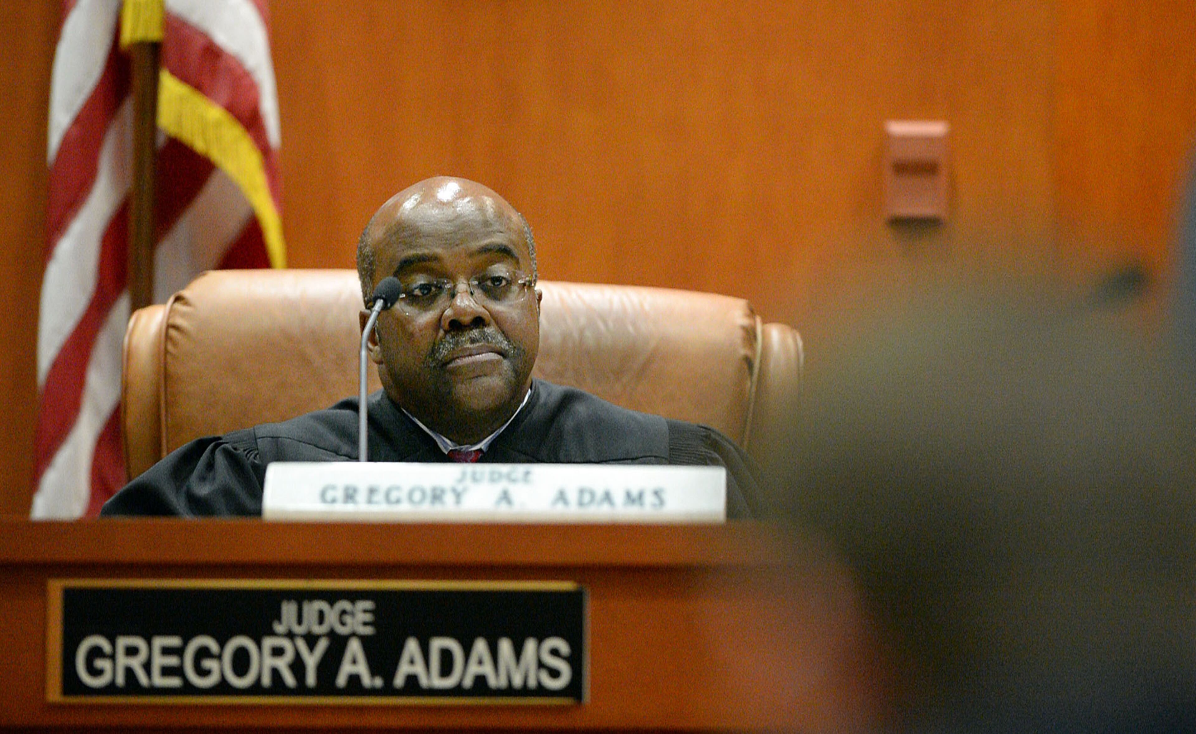 DeKalb County Superior Court Judge Gregory A. Adams presides over a motions hearing for Pat Reid and Tony Pope in their convoluted racketeering case, Tuesday, May 12, 2015. They're asking for a new trial and petitioning to be released from prison awaiting the trial. KENT D. JOHNSON /KDJOHNSON@AJC.COM