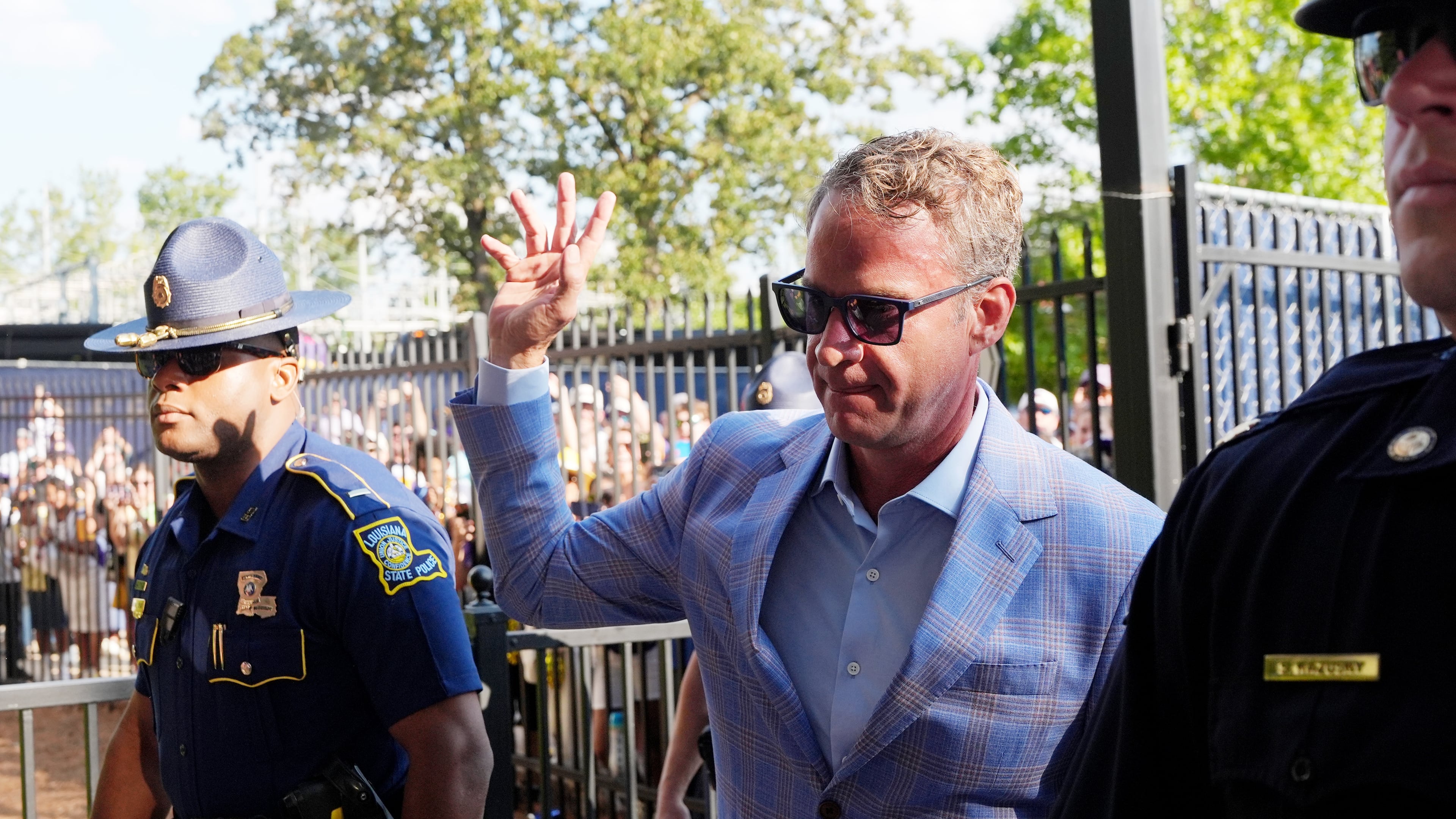 LSU football coach Lane Kiffin waves to fans as he enters the Vaught-Hemingway Stadium prior to an NCAA college football game against Mississippi in Oxford, Miss., Saturday, Sept. 19, 2026. (AP Photo/Rogelio V. Solis)