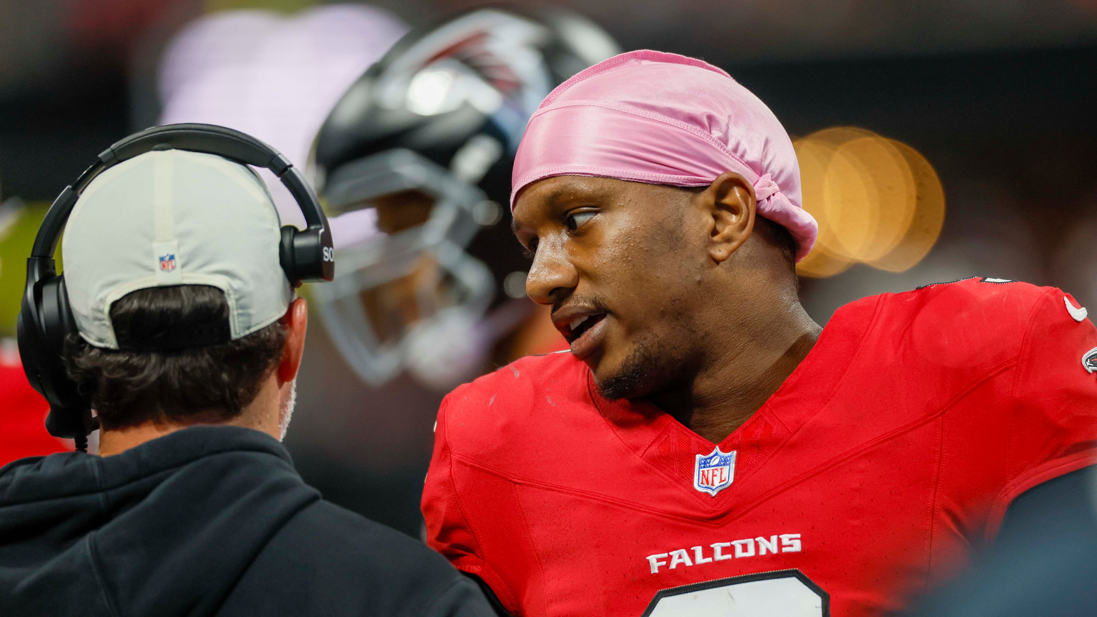 Falcons quarterback Michael Penix Jr. (right) speaks with coach Kevin Stefanski on the sideline against the Bears on Sunday, Oct. 18, 2026, at Mercedes-Benz Stadium in Atlanta. (Miguel Martinez/AJC)