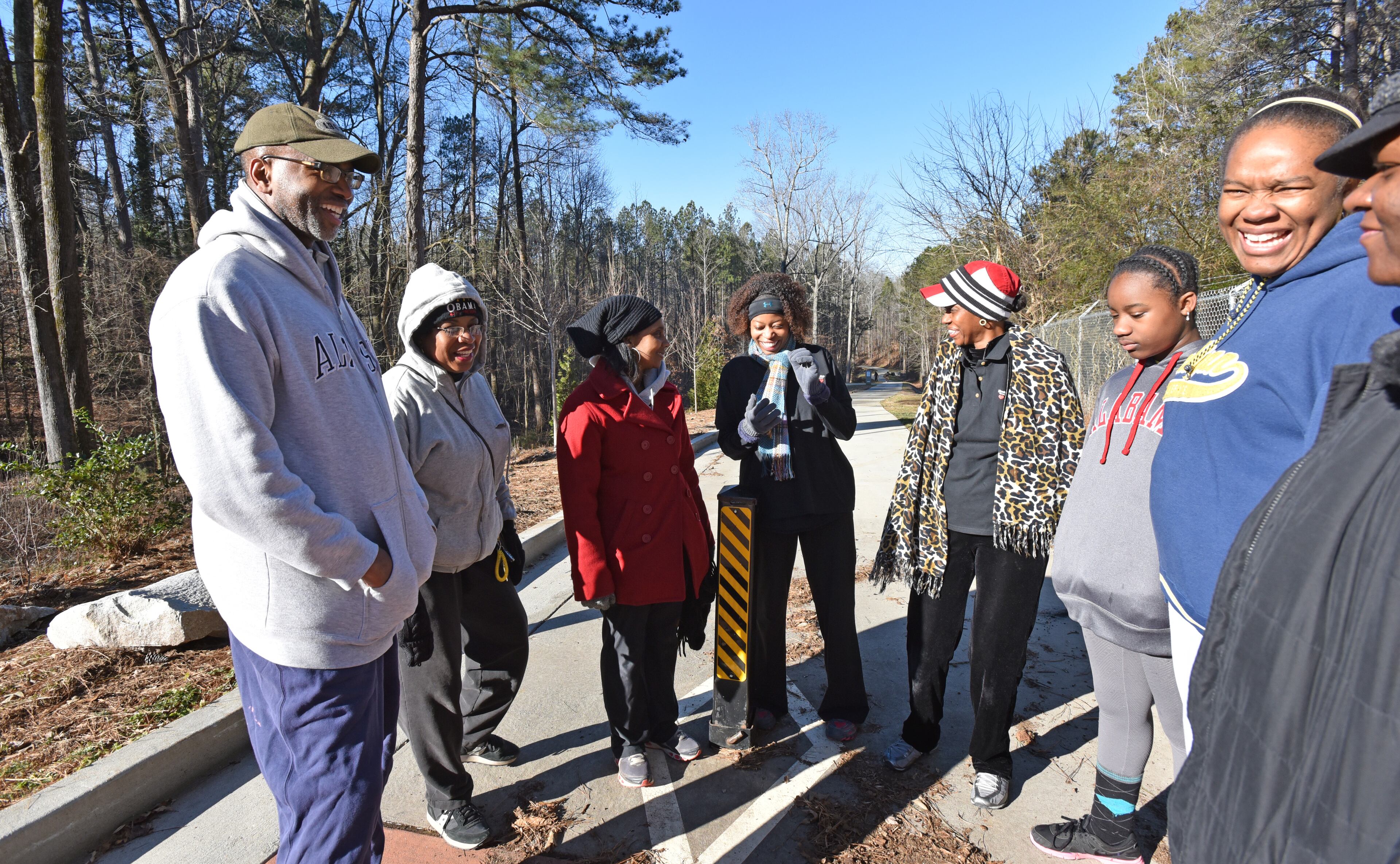 Dr. Charles Moore (left) leads a health education talk at Lionel Hampton-Beecher Hills Park in southwest Atlanta. The the ear, nose and throat specialist founded Healing Community Center to emphasize preventative care and health education. HYOSUB SHIN / HSHIN@AJC.COM