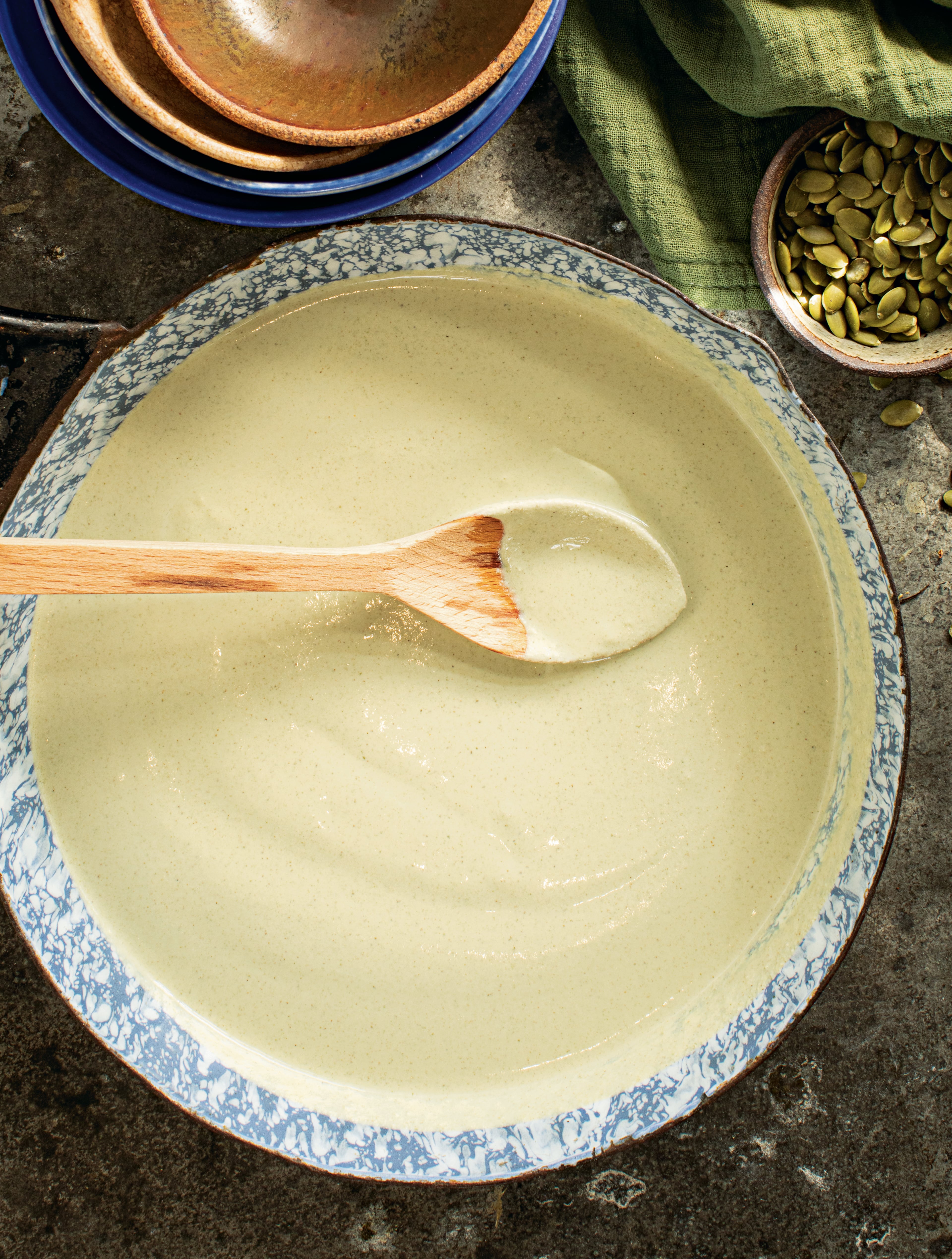 Pumpkin seeds are toasted before blending with spices to create a rich sauce.