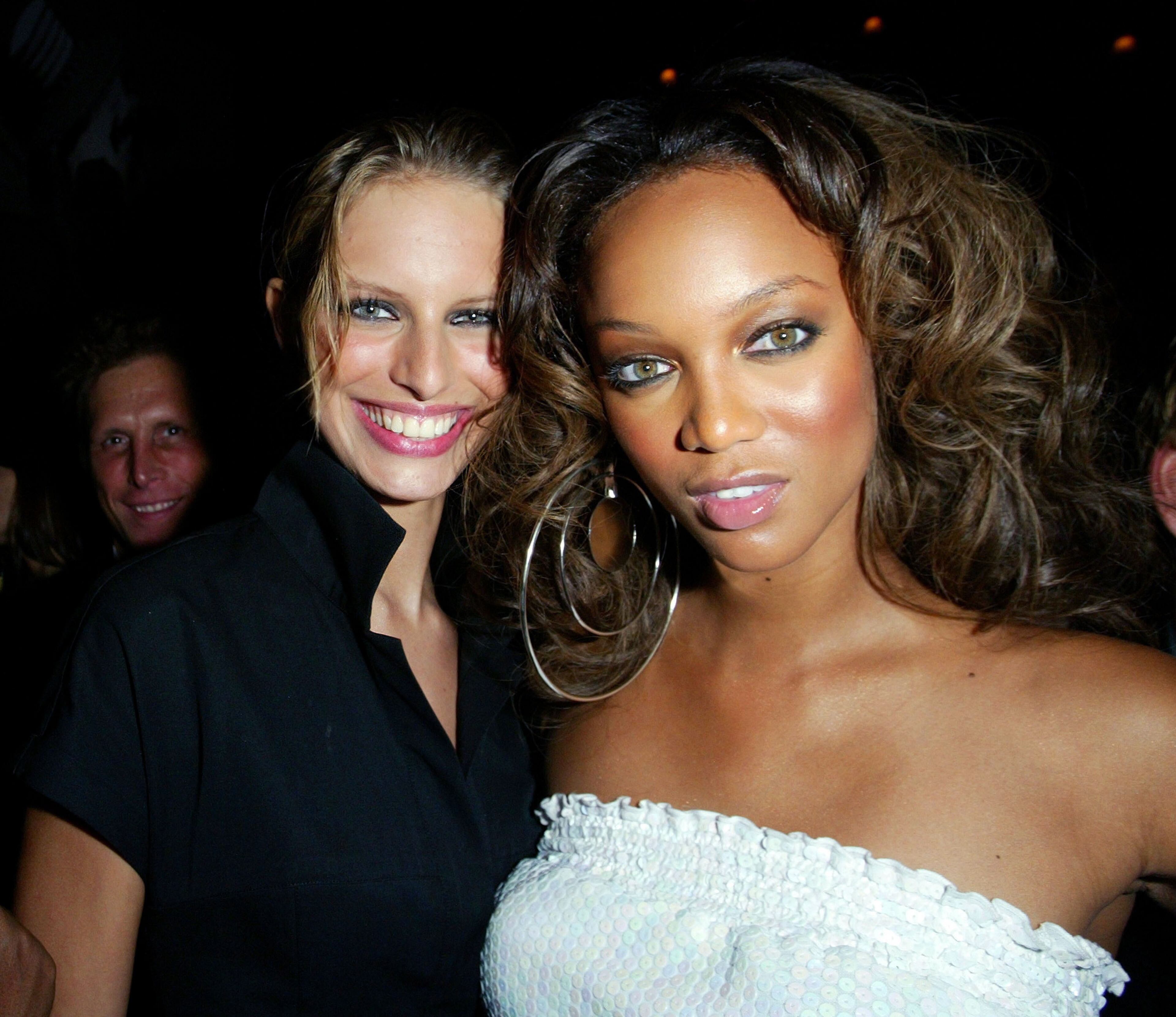Model Karolina Kurkova (left) poses with model Tyra Banks at the 2002 VH1/Vogue Fashion Awards Afterparty at Hudson Hotel Cafeteria on Oct. 15, 2002, in New York City.