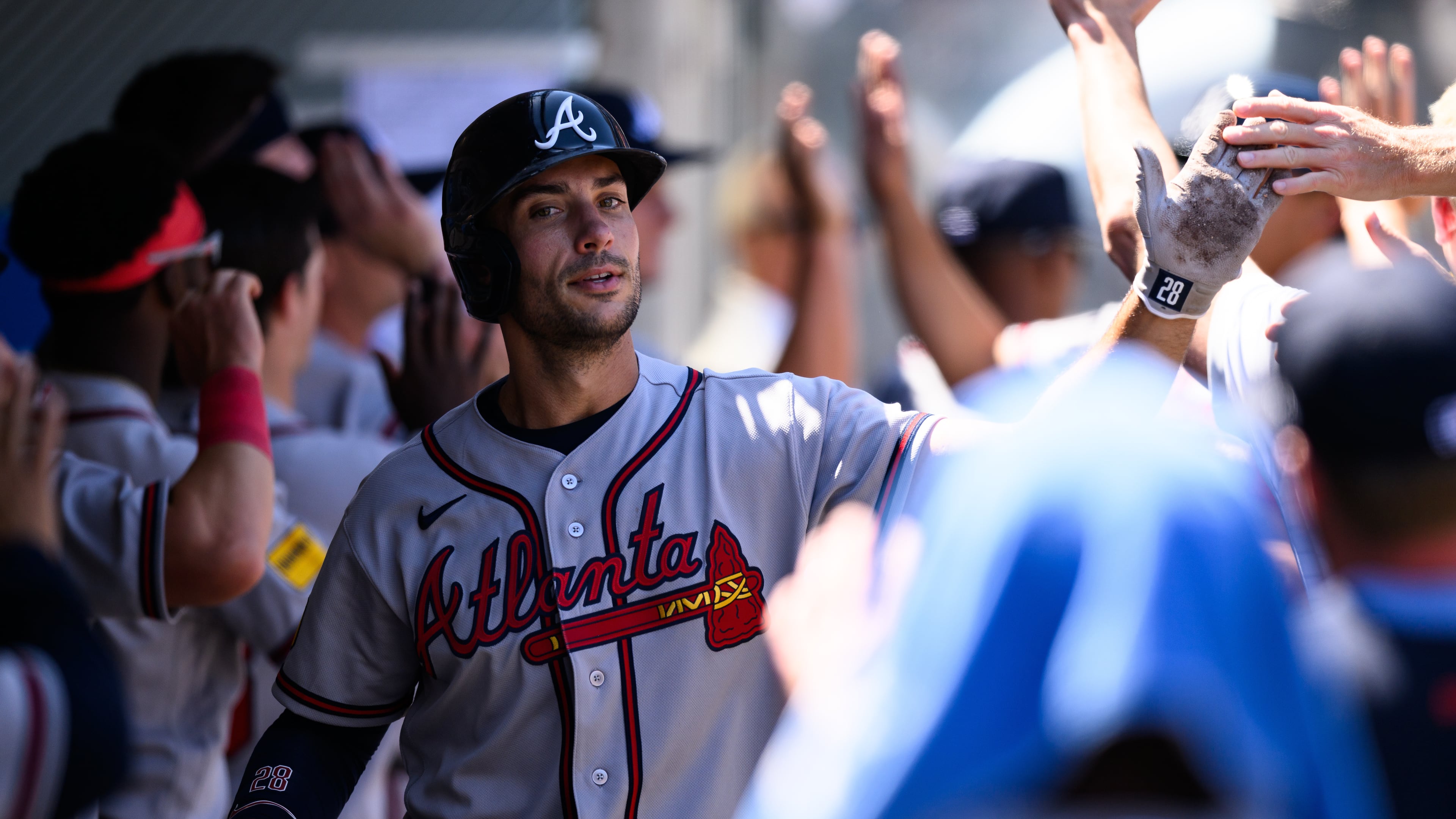 Atlanta Braves first baseman Matt Olson is greeted by teammates after scoring during the third inning of a baseball game against the Los Angeles Angels, Wednesday, April 8, 2026, in Anaheim, Calif. (AP Photo/William Liang)