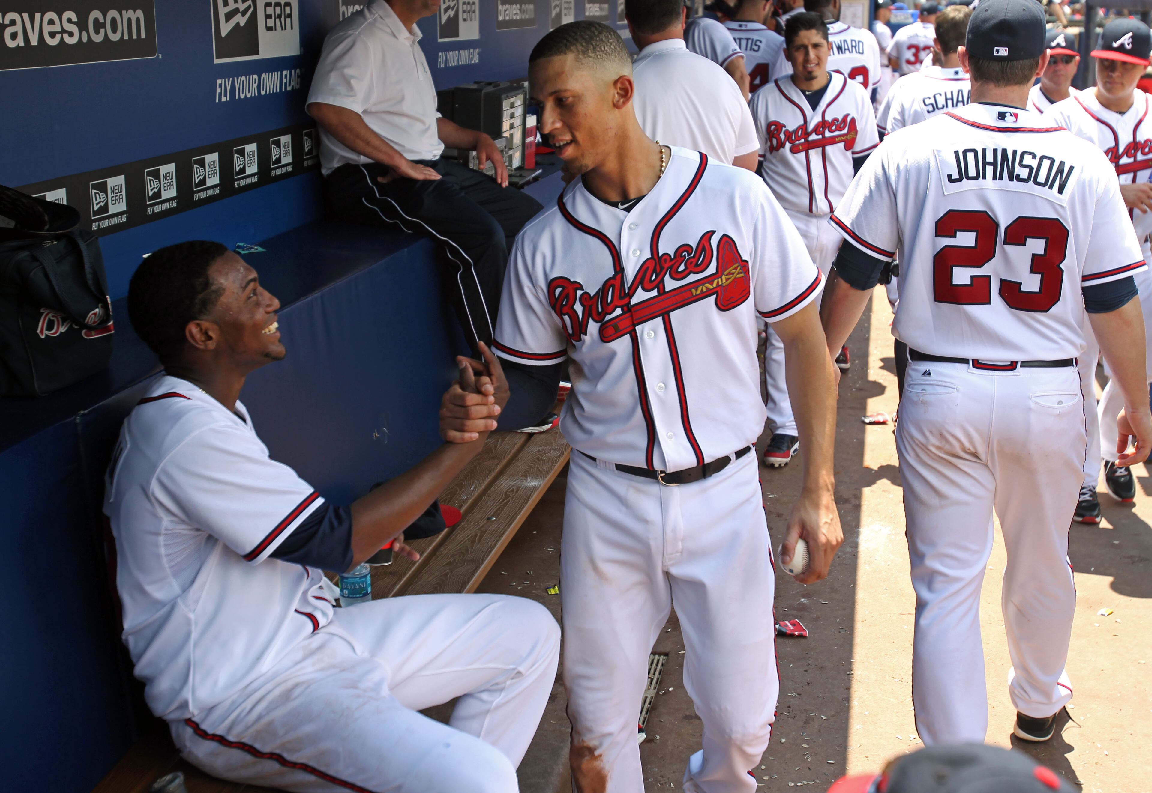 Teheran, left, celebrates with shortstop Andrelton Simmons following Teheran's dominant performance. JASON GETZ / JGETZ@AJC.COM