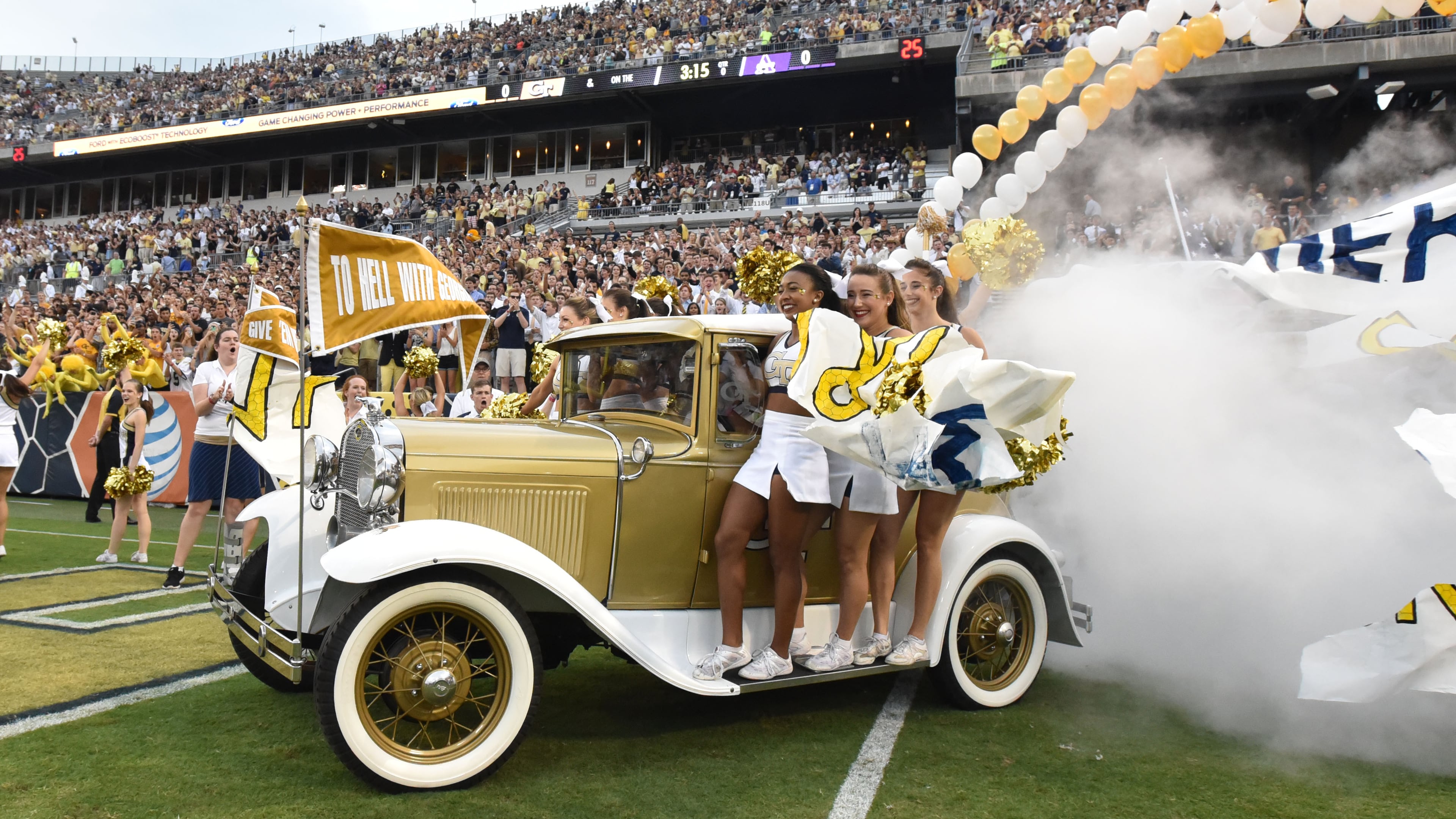 Georgia Tech’s Ramblin’ Wreck leads the band, cheerleaders, Buzz, players, and coaches before the start of the Georgia Tech season opener against the Alcorn State Braves in Bobby Dodd Stadium on Thursday, September 3, 2015. HYOSUB SHIN / HSHIN@AJC.COM