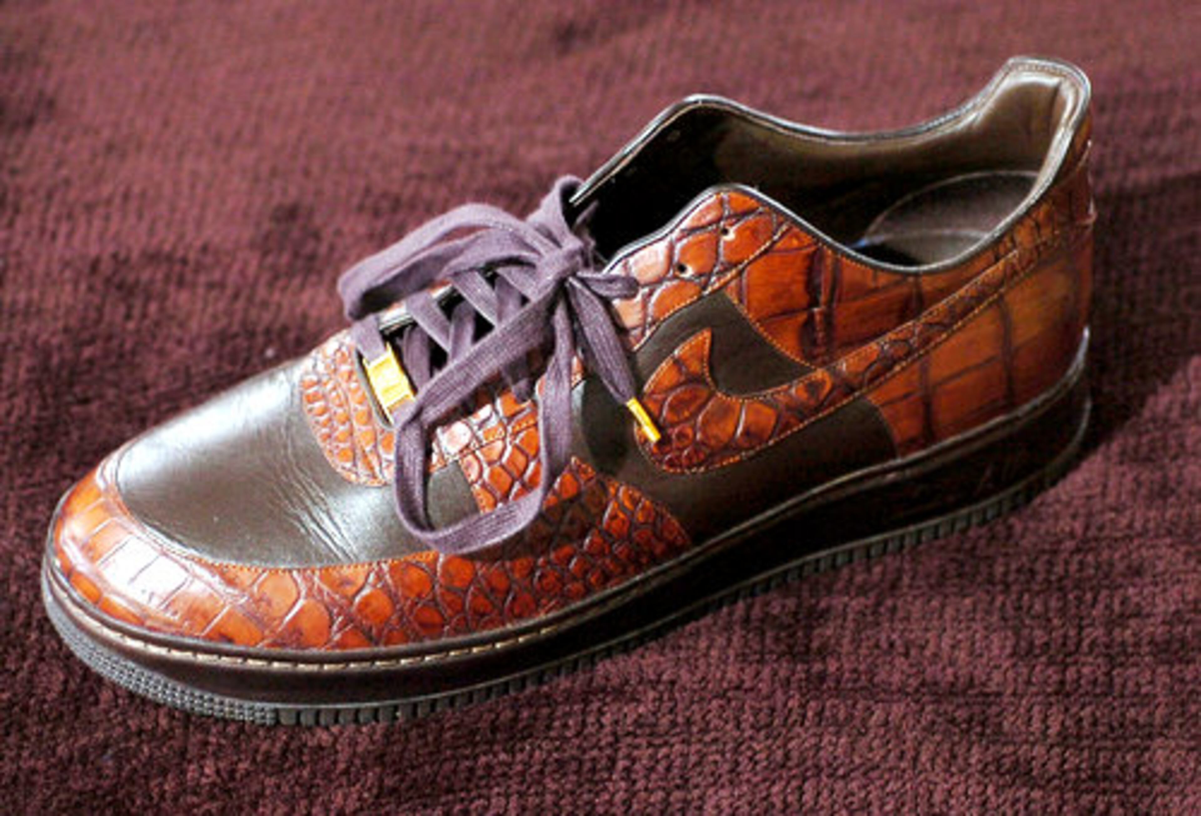 A Nike Air Force I Crocodile shoe, a limited edtion shoe, was handmade by Nike using actual crocodile skin and either 18K or 24K gold.
