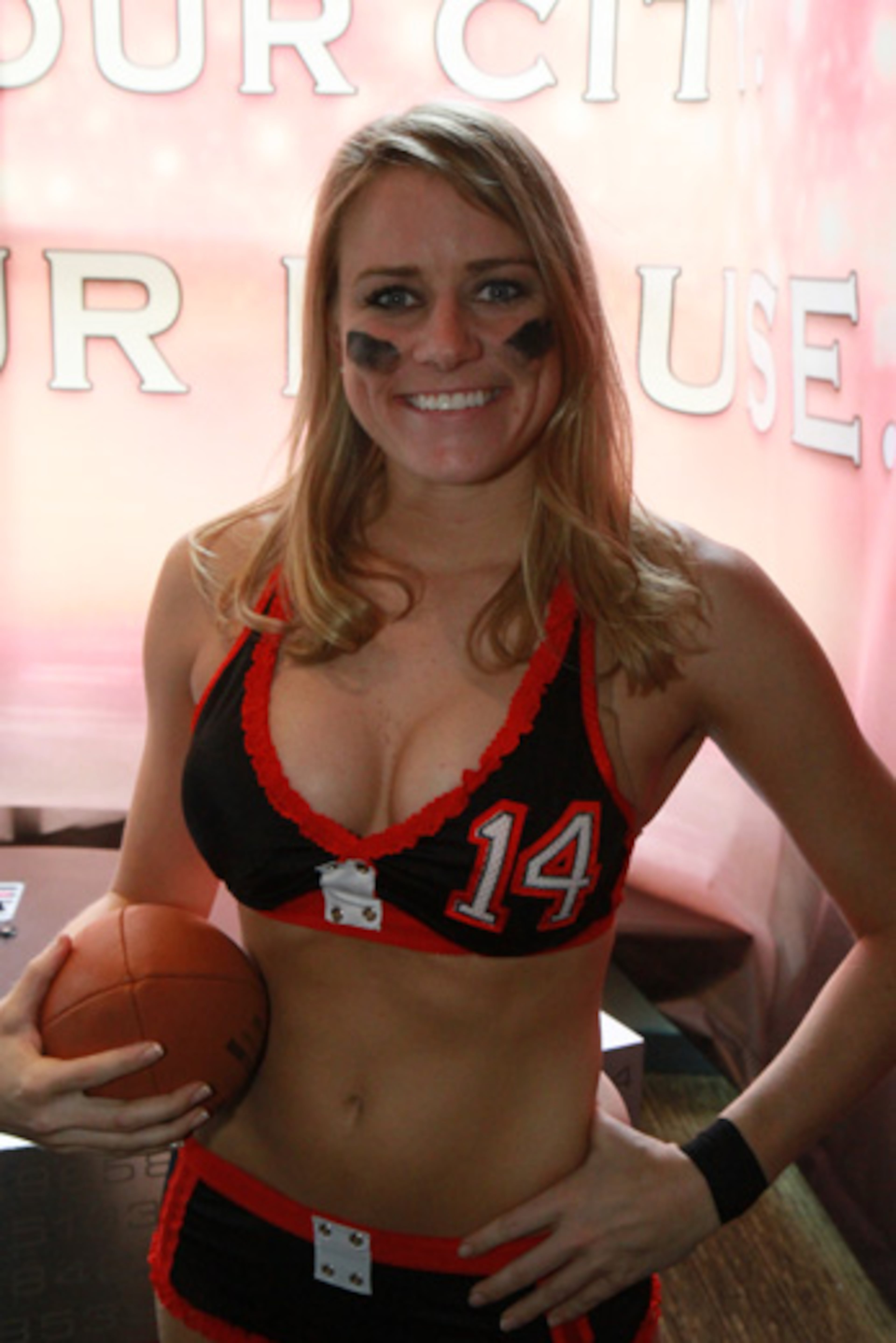 These are members of the Atlanta Steam. The team is part of the Legends Football League, formerly the Lingerie Football League. Brittany Morgan is the quarterback.
