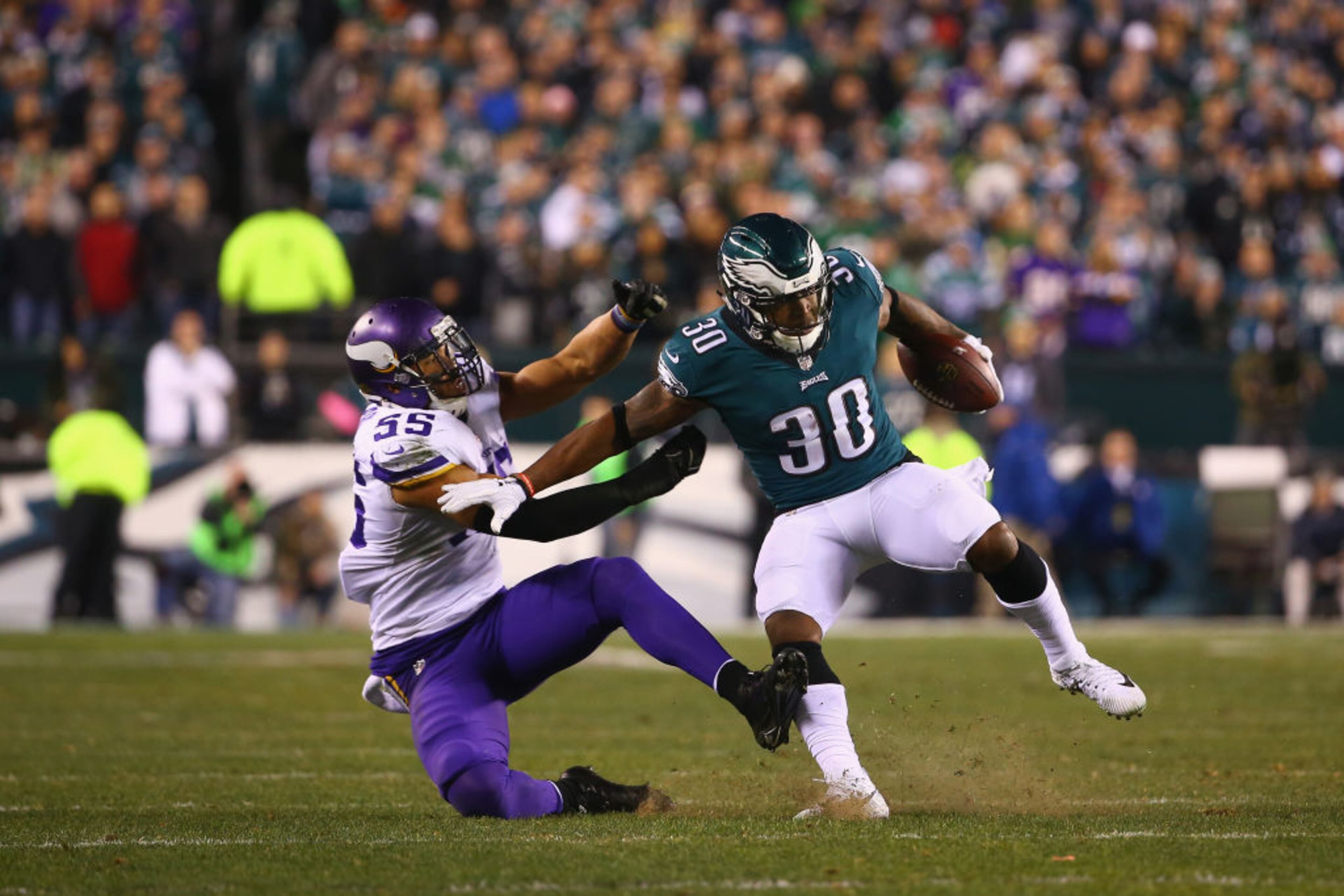 PHILADELPHIA, PA - JANUARY 21: Corey Clement #30 of the Philadelphia Eagles uses a stiff arm against Anthony Barr #55 of the Minnesota Vikings during the second quarter in the NFC Championship game at Lincoln Financial Field on January 21, 2018 in Philadelphia, Pennsylvania. (Photo by Mitchell Leff/Getty Images)