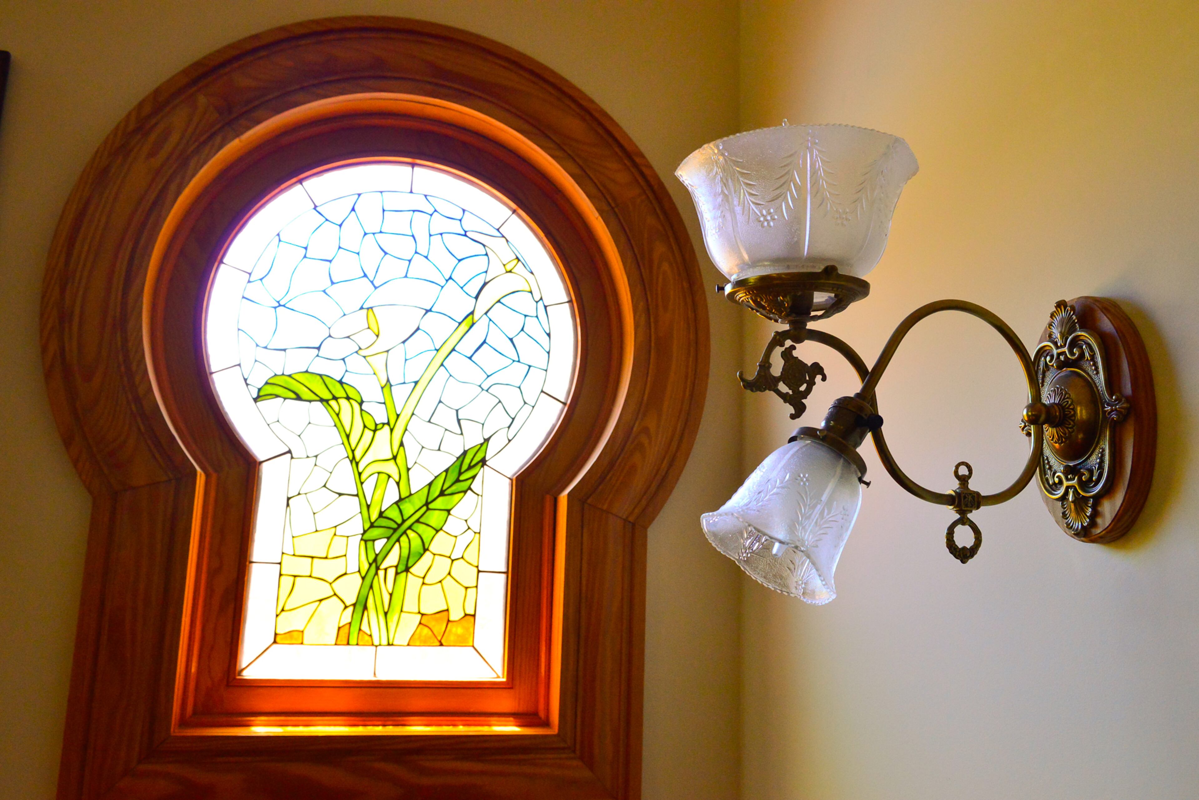 The keyhole-shaped window was a common feature in architect George F. Barber's Victorian designs, the couple said. The stained glass design was based on homeowner Carolyn Dufano's favorite flower, the calla lily.