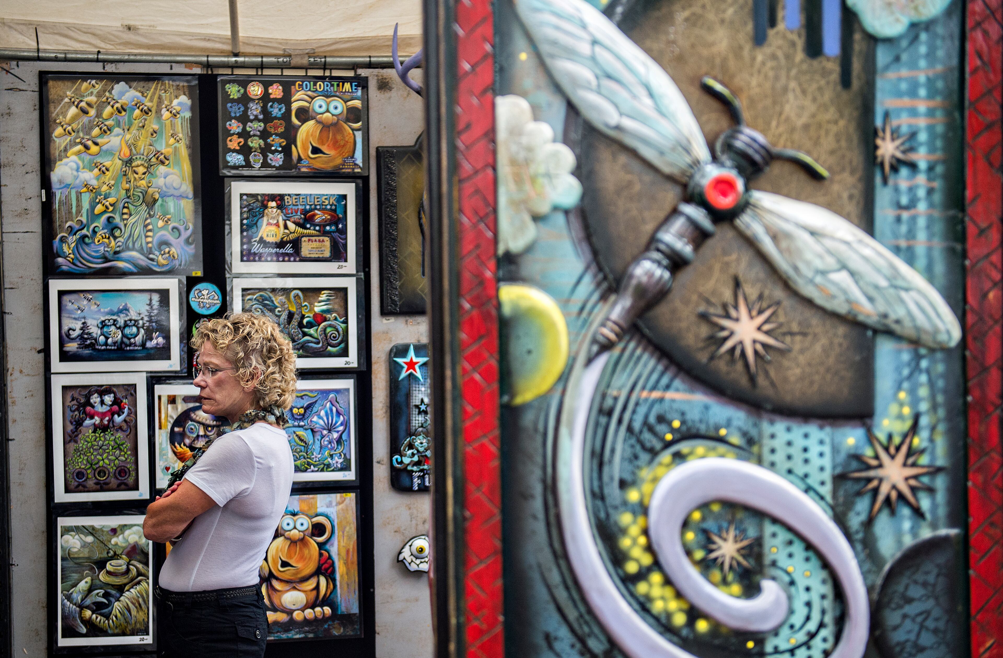August 29, 2015 Atlanta - Arlene Klostermann walks through H.C. Warner's booth during the 13th annual Grant Park Summer Shade Festival on Saturday, August 29, 2015. The two day festival featured some of Atlanta's most well known artists, live music, food and children's activities. JONATHAN PHILLIPS / SPECIAL