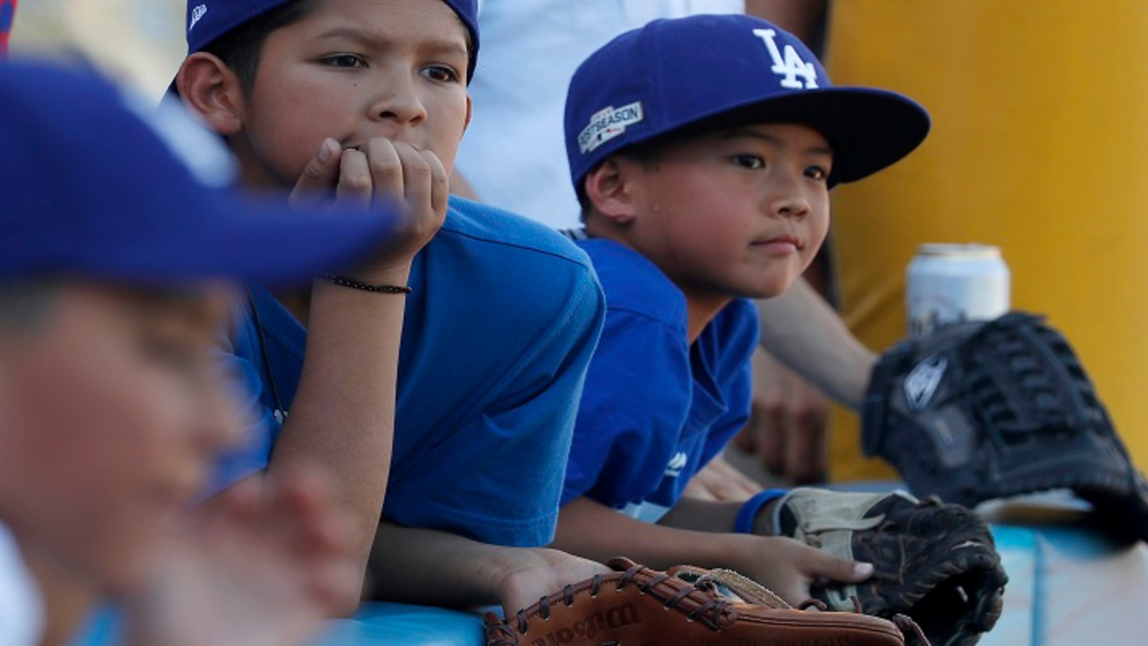 Young fans wait to snag souvenir balls during batting practice before the start of Game 1 of the World Series between the Los Angeles Dodgers and the Houston Astros at Dodger Stadium in Los Angeles on Tuesday, Oct. 24, 2017. (Luis Sinco/Los Angeles Times/TNS)