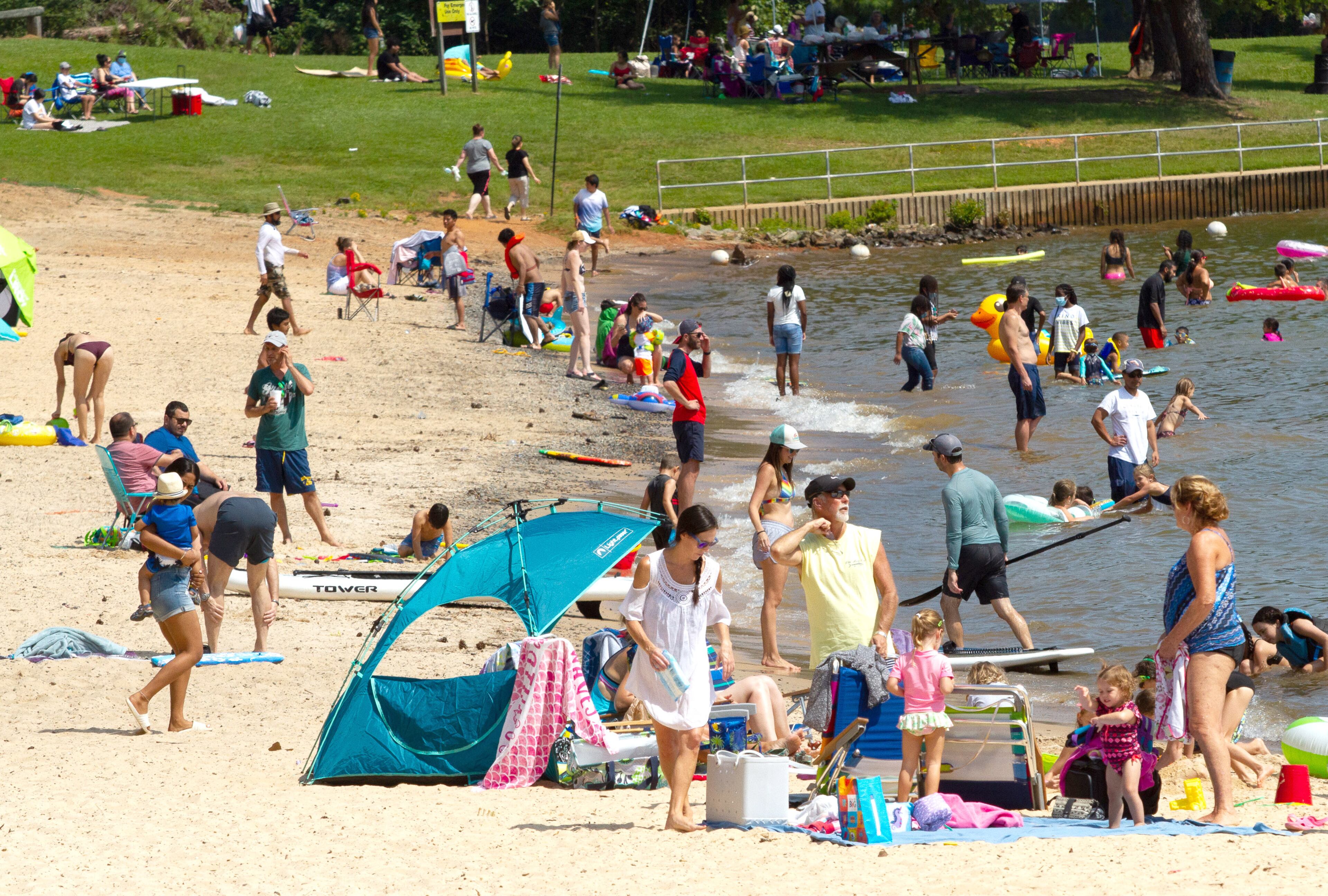People enjoy the beach Sunday at Mary Alice Park on Lake Lanier, September 6, 2020. STEVE SCHAEFER / SPECIAL TO THE AJC