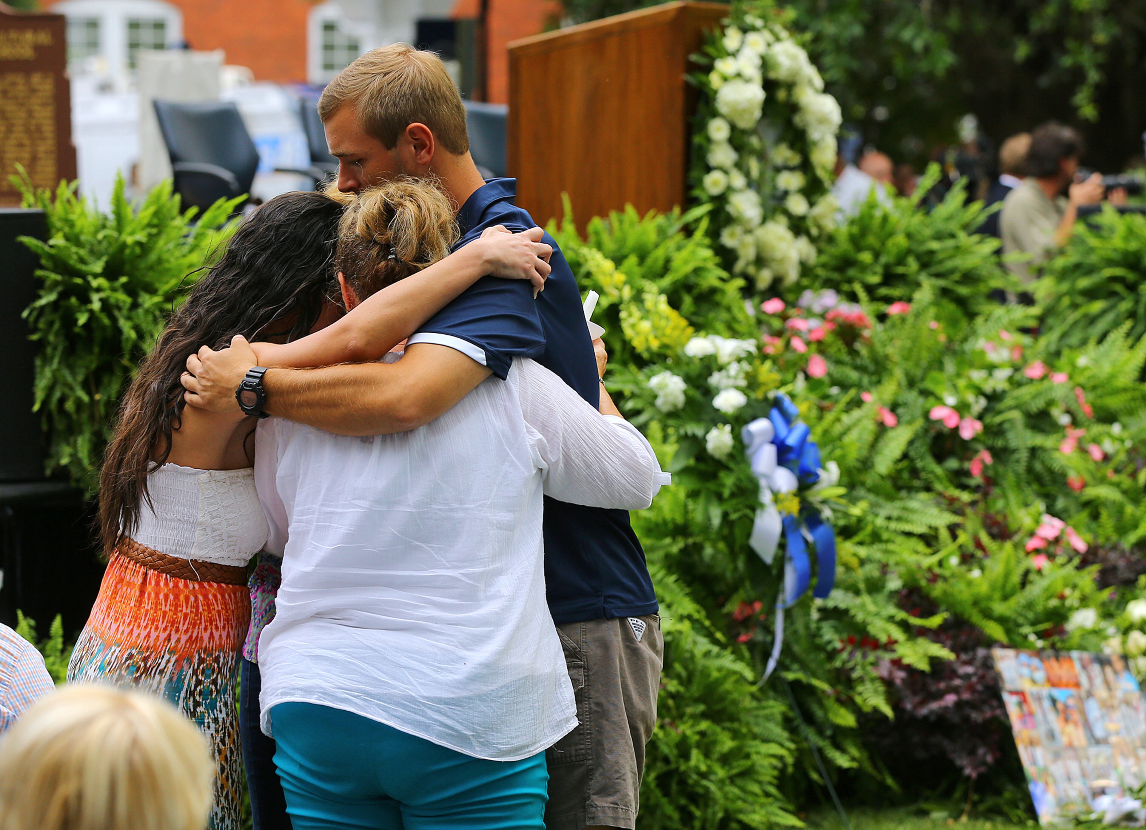 Family members embrace arriving with thousands for a Memorial Service on Thursday, April 23, 2015, in Statesboro. Five nursing students died the day before in a vehicle pileup. Curtis Compton / ccompton@ajc.com