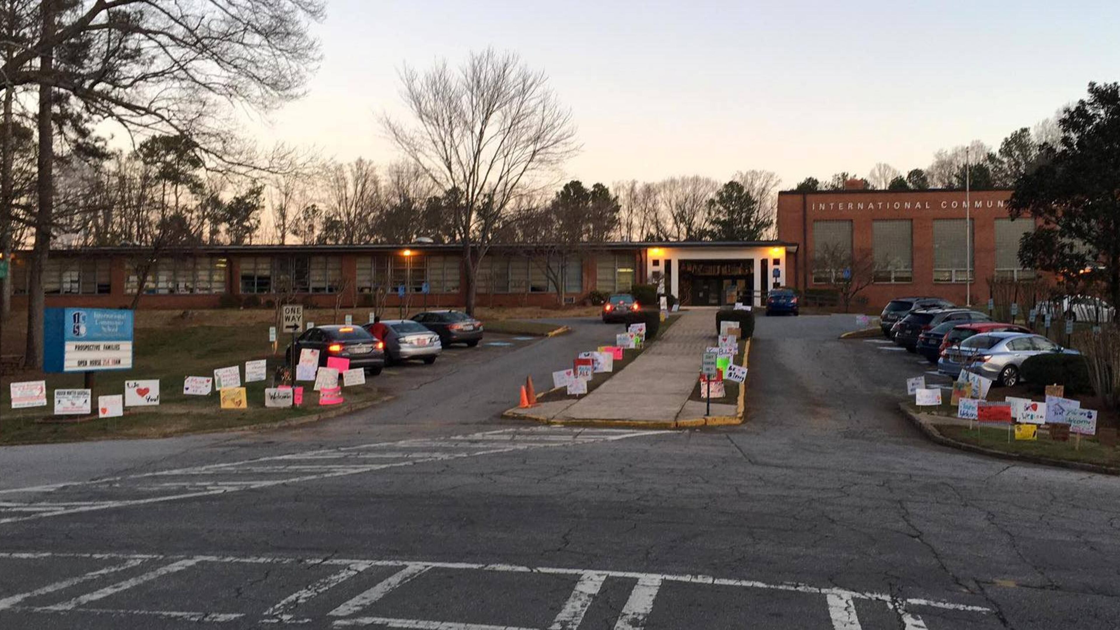 Students at DeKalb's International Community School, many of whom are immigrants and refugees, arrived today to a sea of signs of support from the surrounding Medlock neighborhood. A public charter school, ICS has more than 400 students representing more than 30 nationalities and speaking 25 languages. (ICS Facebook)