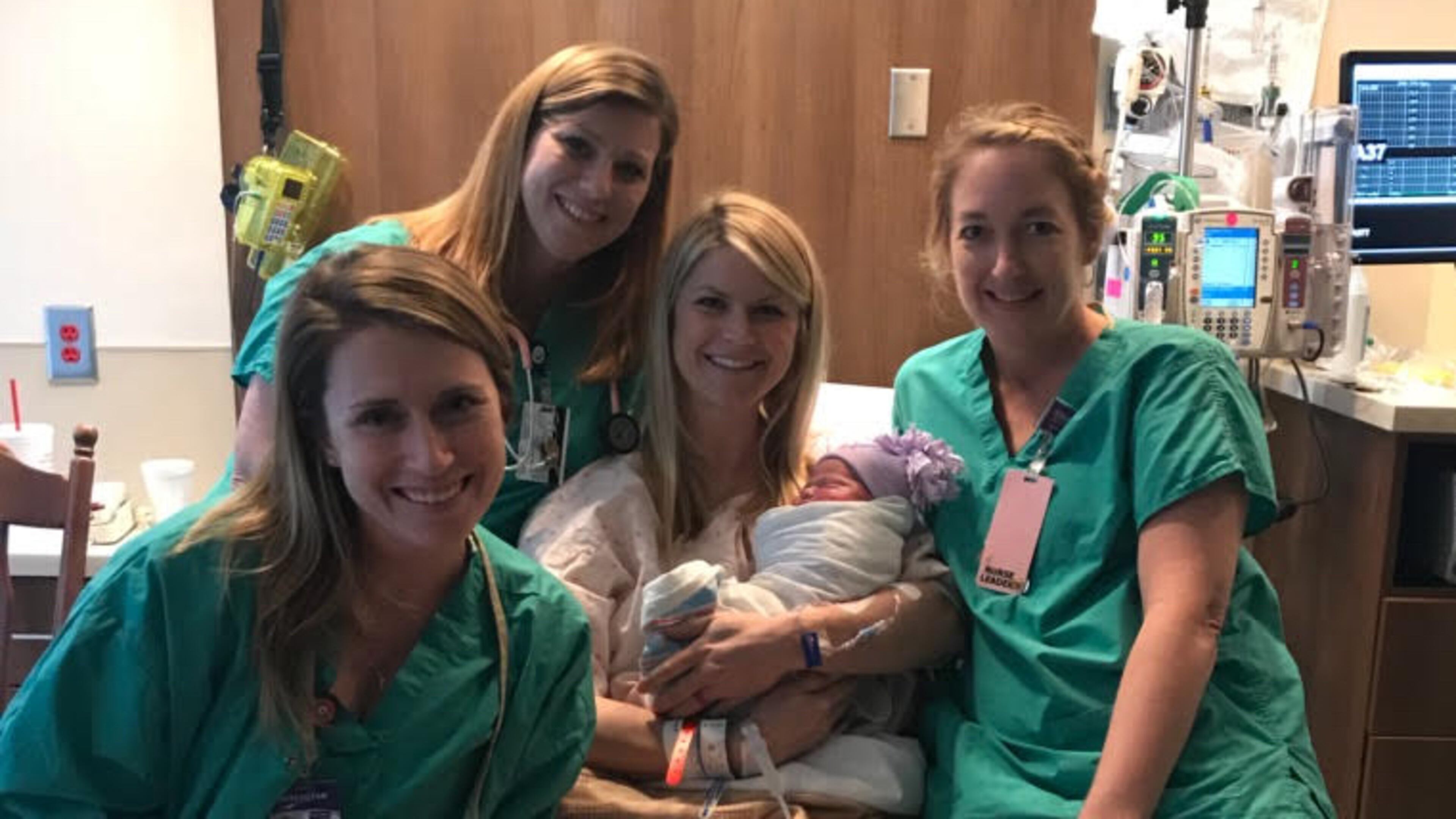 Nurse Kinsey Close (center) with her nursing colleagues after delivering her third child.