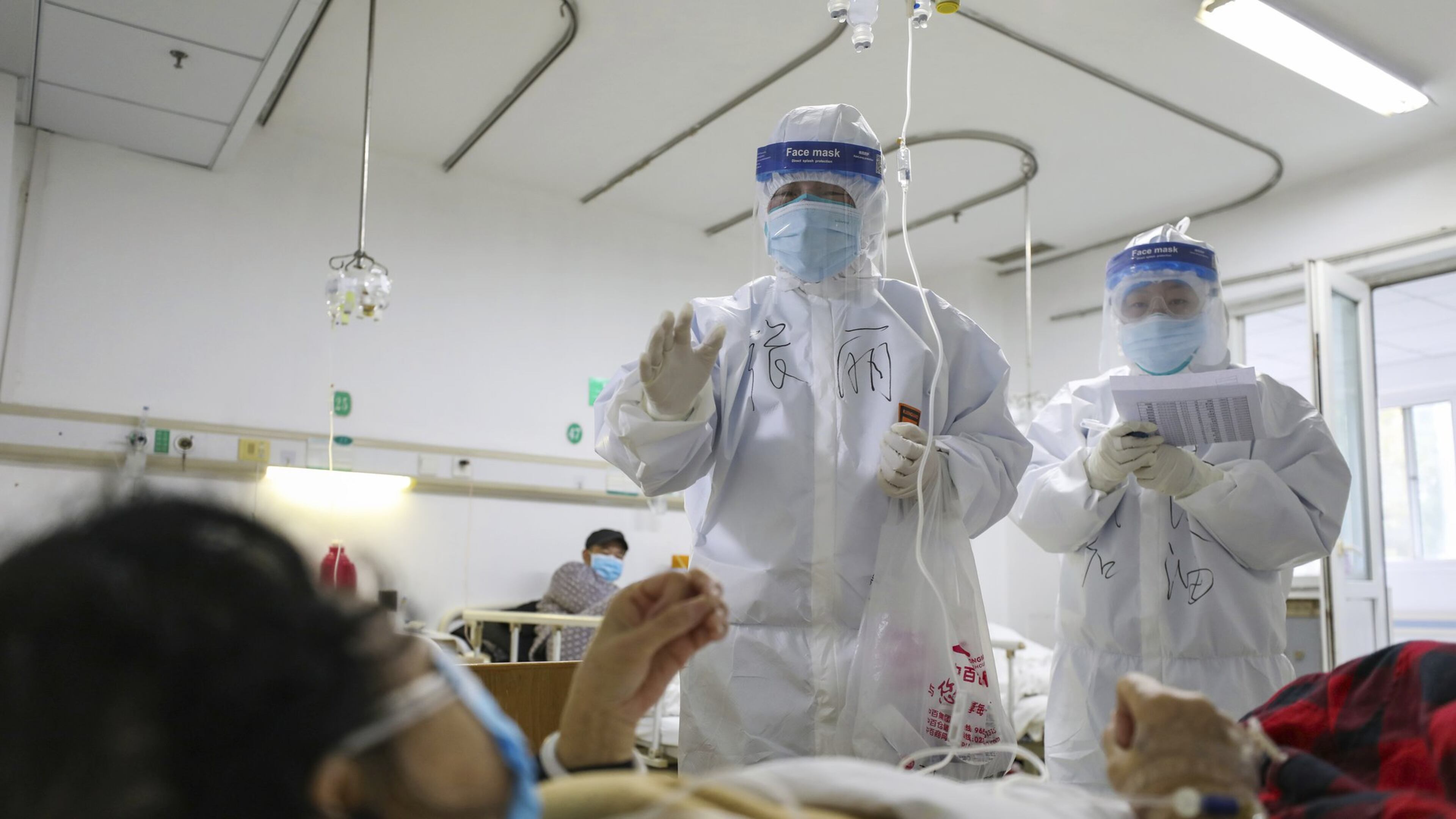 The economic impact of the coronavirus is impossible to predict, but the effect is nearly certain to slow growth, said Rajeev Dhawan, director of the Economic Forecasting Center at Georgia State University. Here, medical workers check on patients in Jinyintan Hospital in Wuhan, China, where the virus was first reported. (Chinatopix Via AP)