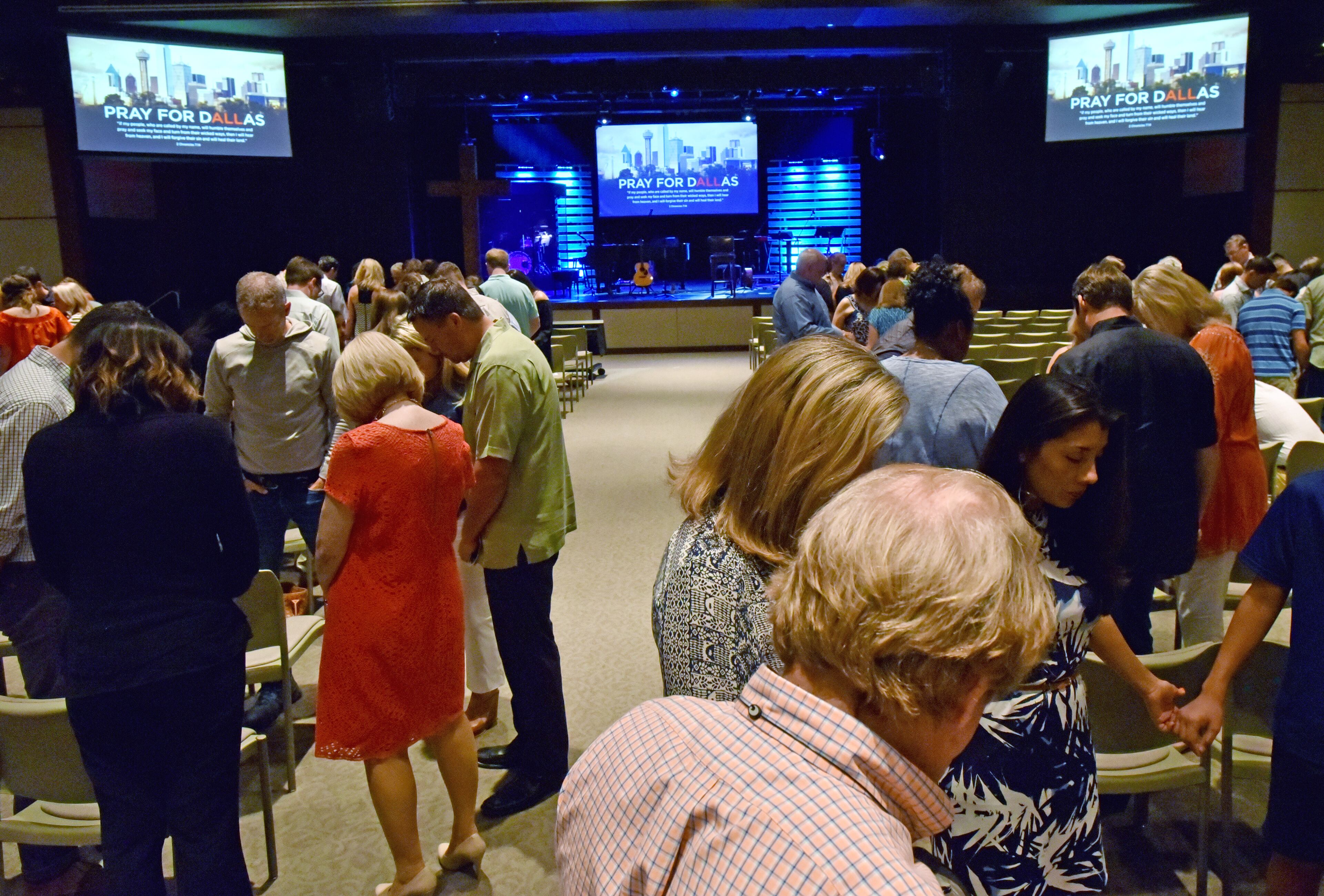 July 10, 2016 Dallas, Texas - Church members join hands as they take part in a service at Park Cities Baptist Church in Dallas on Sunday, July 10, 2016. HYOSUB SHIN / HSHIN@AJC.COM