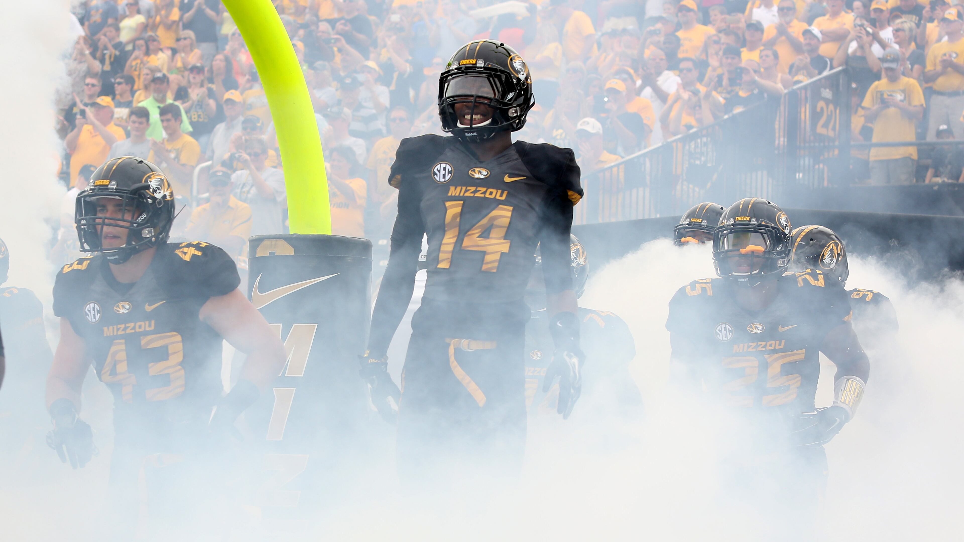 COLUMBIA , MO - SEPTEMBER 20: Raymond Wingo #14 and members of the Missouri Tigers takes to the field prior to a game against the Indiana Hoosiers at Memorial Stadium on September 20, 2014 in Columbia, Missouri. (Photo by Ed Zurga/Getty Images)