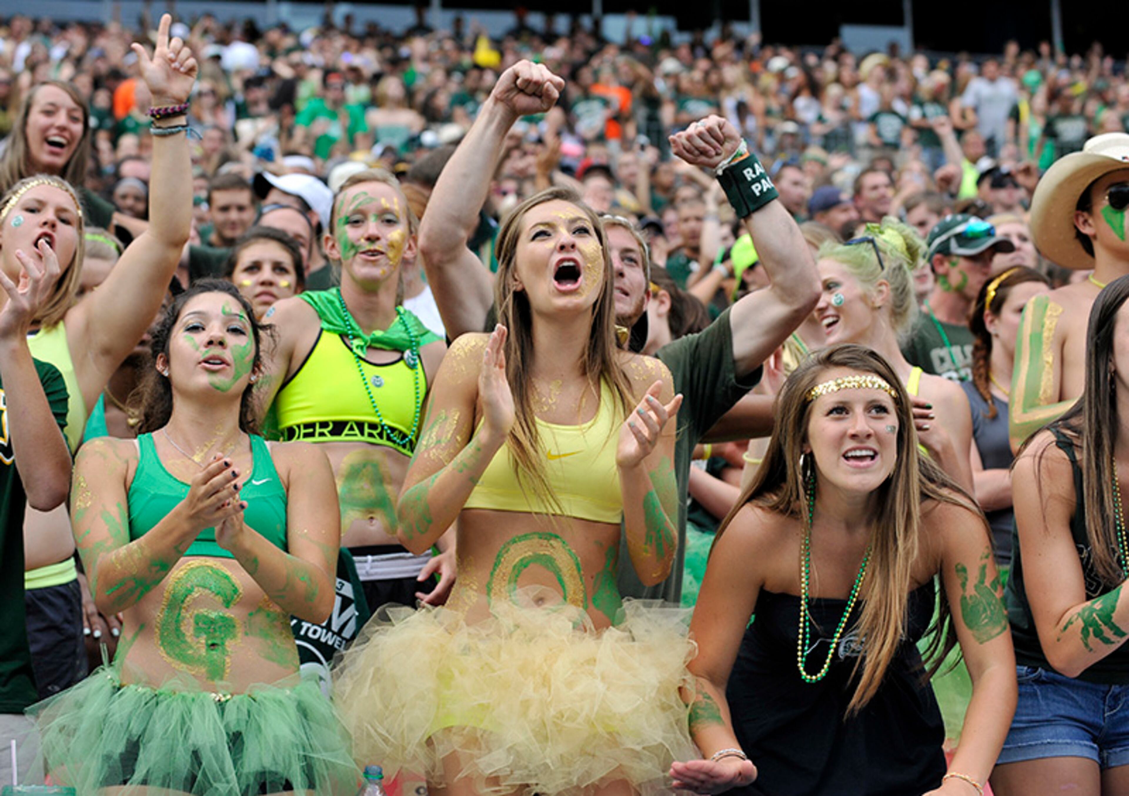 Colorado State fans cheer against Colorado during the second half of an NCAA college football game Sunday Sept. 1, 2013, in Denver. Colorado beat Colorado State 41-27 to win the Rocky Mountain Showdown.