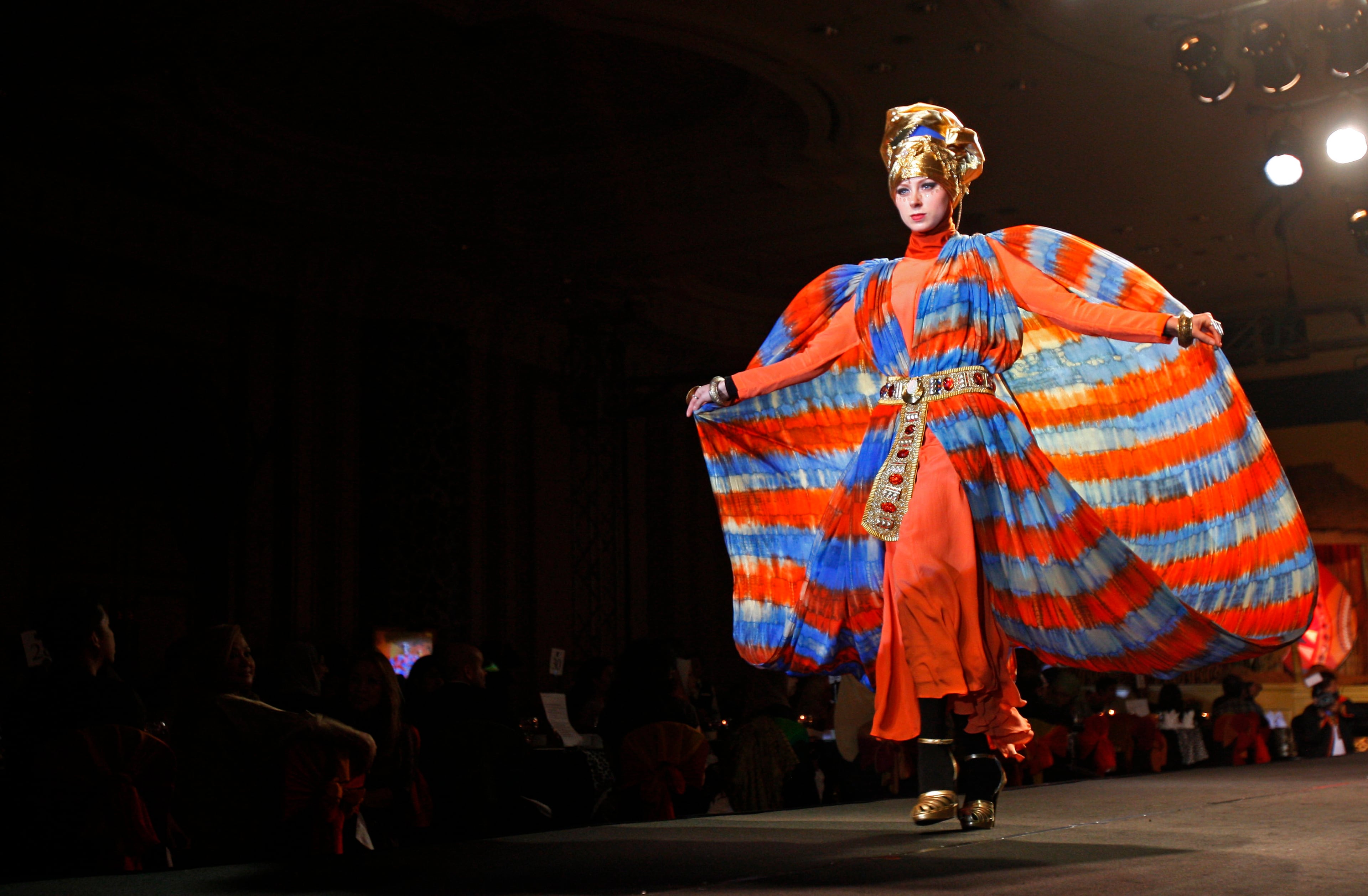 A model presents a creation by designer Dian Pelangi from Indonesia during the Islamic Fashion Festival in Kuala Lumpur, Malaysia, Monday, Nov. 5, 2012.