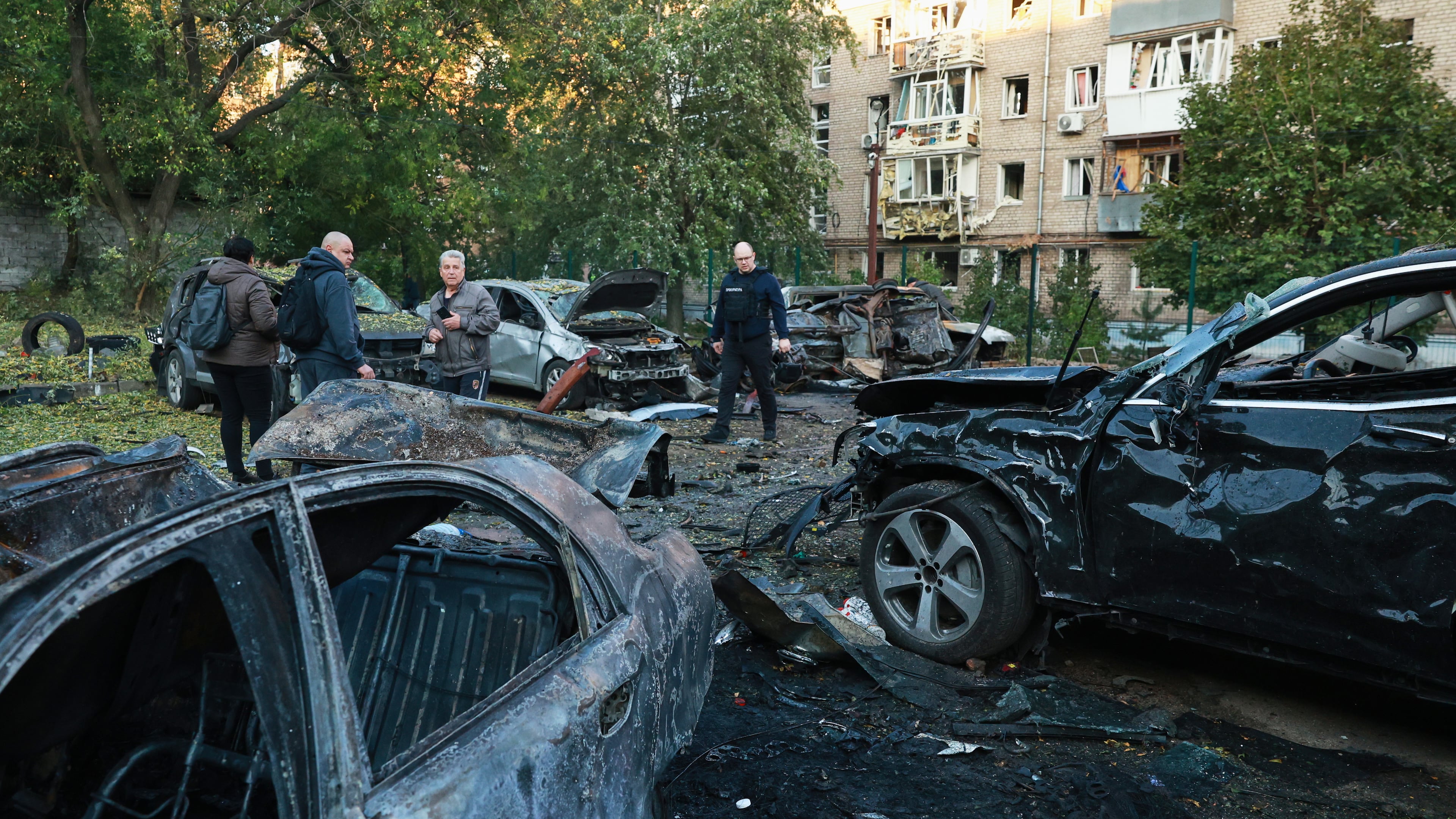 Cars are seen damaged by a Russian strike on residential neighbourhood in Zaporizhzhia, Ukraine, Friday, Oct. 9, 2026. (AP Photo/Kateryna Klochko)