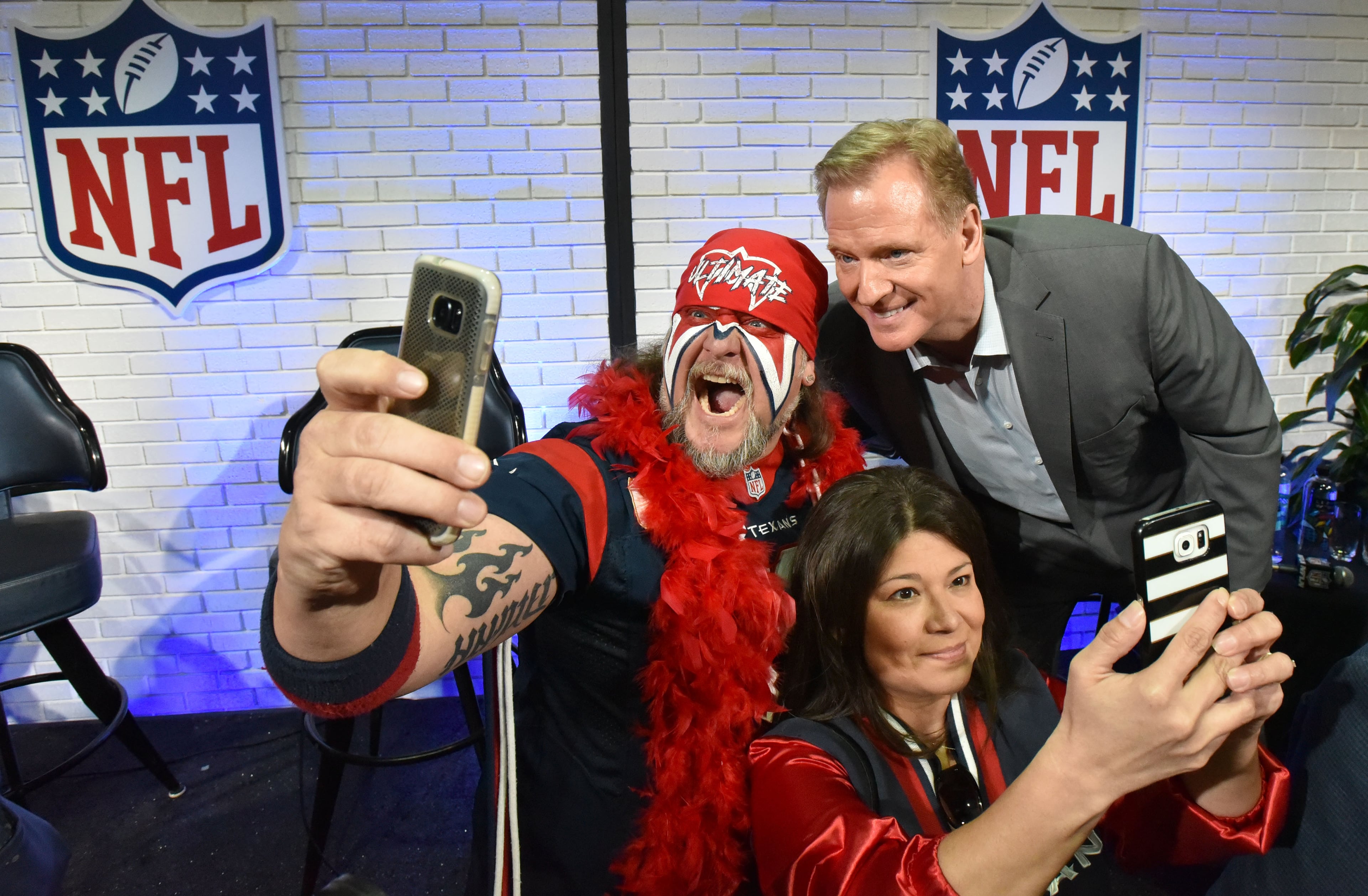 NFL Commissioner Roger Goodell takes a selfie with some energetic fans. AJC photo: Hyosub Shin