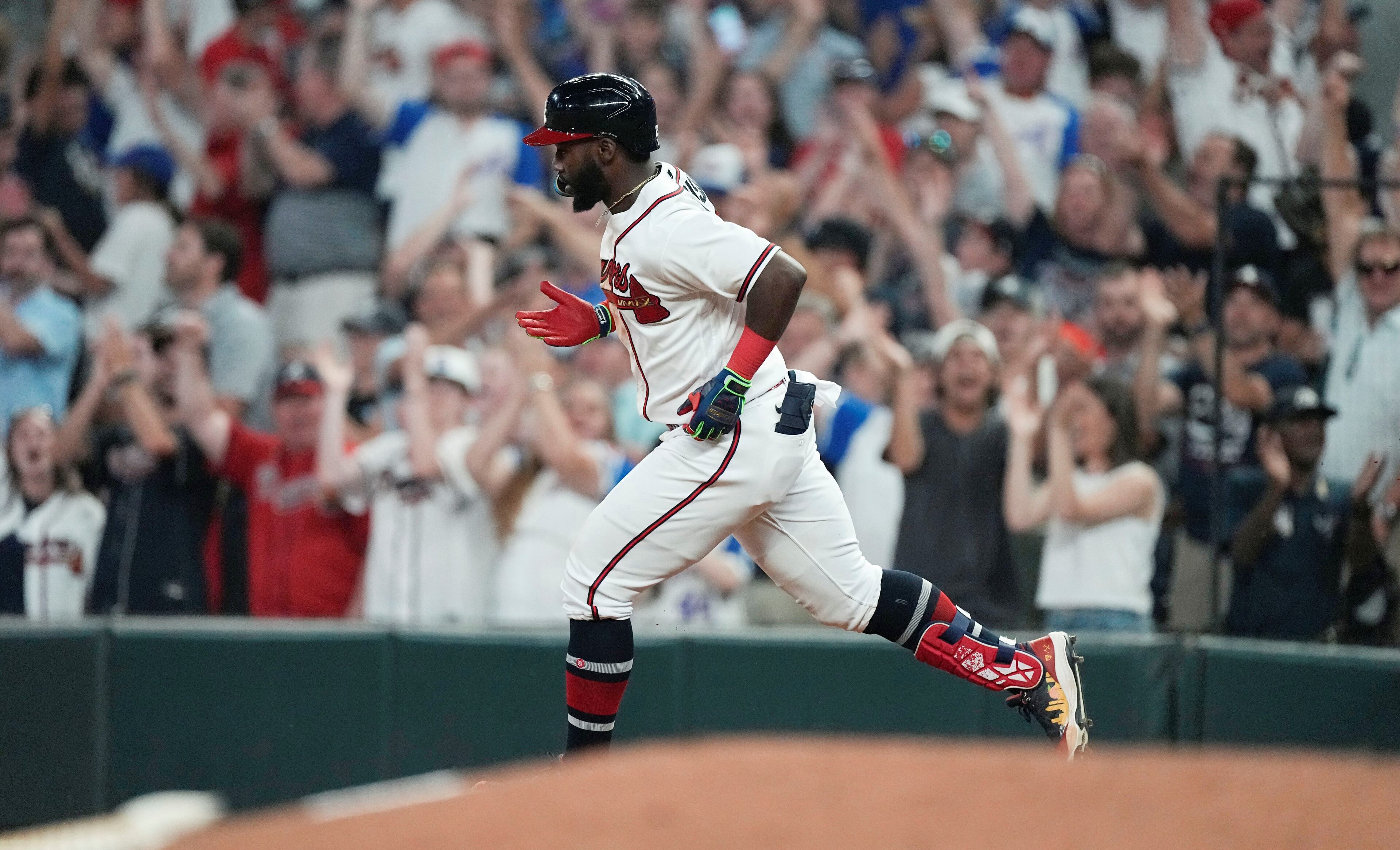 Michael Harris II (23) rounds the bases aafter hitting a two-run home run in the eighth inning of a baseball game against the New York Mets, Wednesday, June 7, 2023, in Atlanta. (AP Photo/John Bazemore)