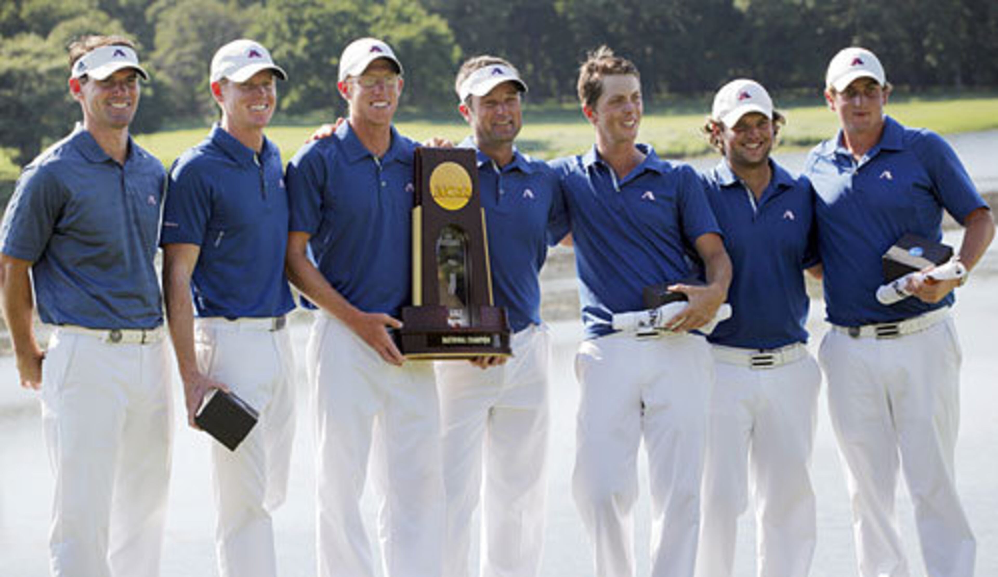 The Augusta State men's golf team, from left, assistant coach Kevin McPherson, Mitchell Krywulycz, Carter Newman, head coach Josh Gregory, Olle Bengtsson, Patrick Reed and Henrik Norlander, pose for a photo with the championship trophy after winning the team match final of the NCAA Division I Men's Golf Championship at Karsten Creek Golf Course in Stillwater, Okla., Sunday, June 5, 2011.