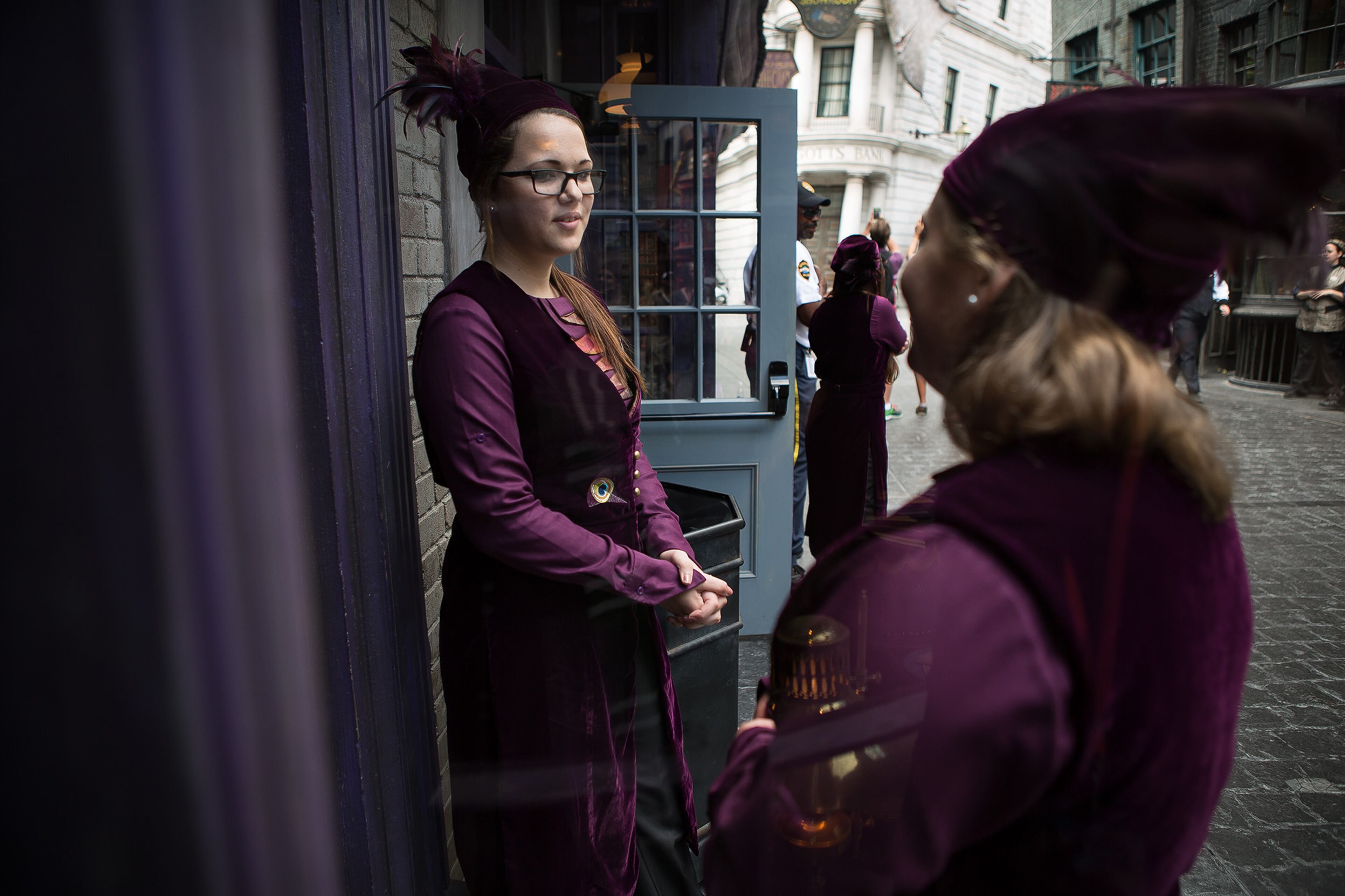 Sierra Herring, left, of Tampa, and Summer Hernandez, right, of Orlando, stand outside of Madam Malkin's Robes for All Occasions shop in the Wizarding World of Harry Potter Diagon Alley on Thursday, June 19, 2014 at Universal Studios in Orlando. (Madeline Gray / The Palm Beach Post)
