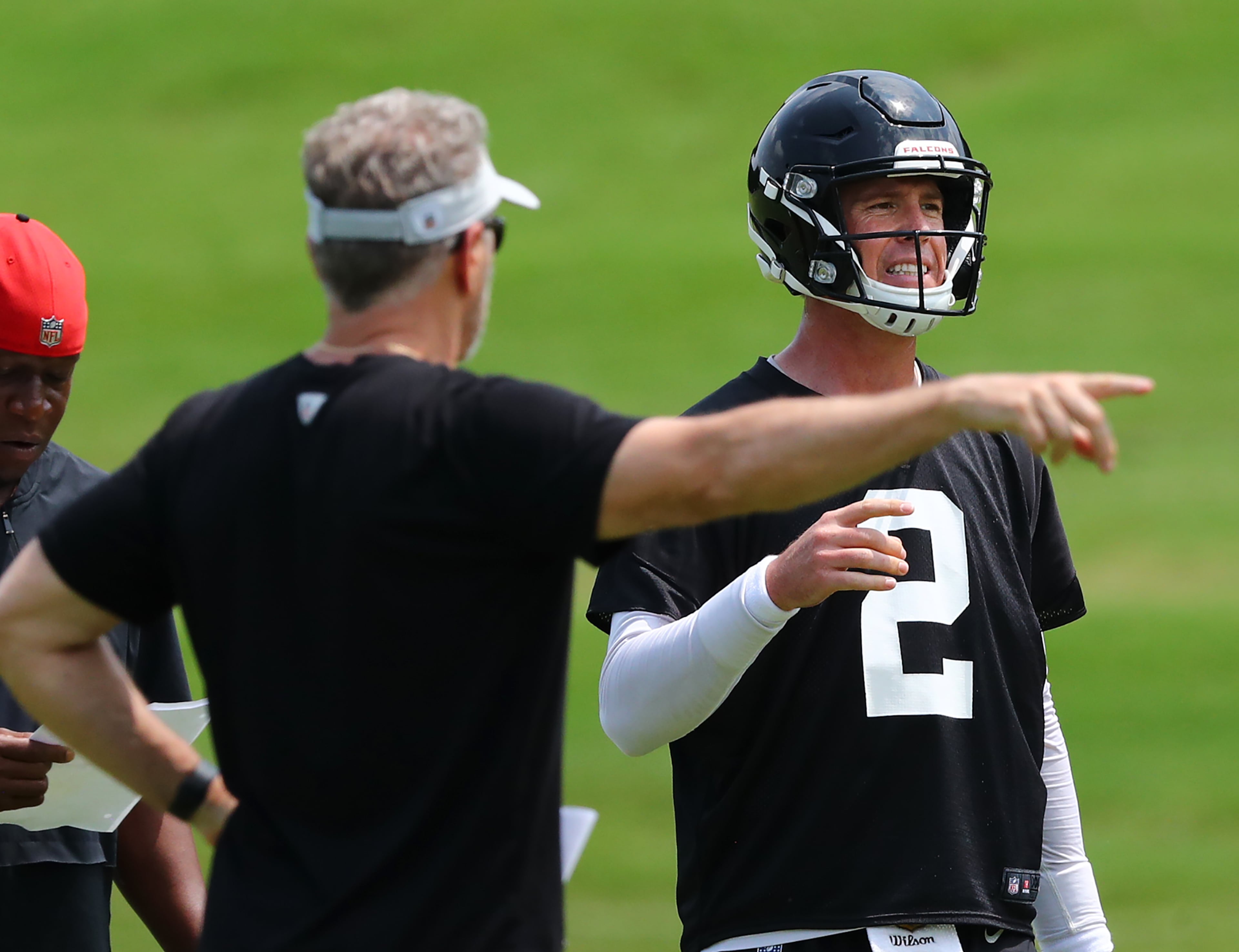 Falcons offensive coordinator Dirk Koetter works with quarterback Matt Ryan during team practice on Thursday, May 23, 2019, in Flowery Branch. Koetter was also the offensive coordinator for the team from 2012 to 2014. Curtis Compton/ccompton@ajc.com